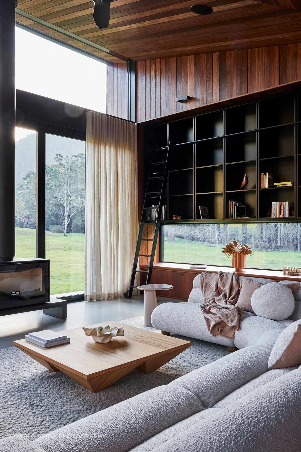 shaun-lockyer-architects-amaroo-rural-interior-design-living-room-fireplace-bookshelf.jpg