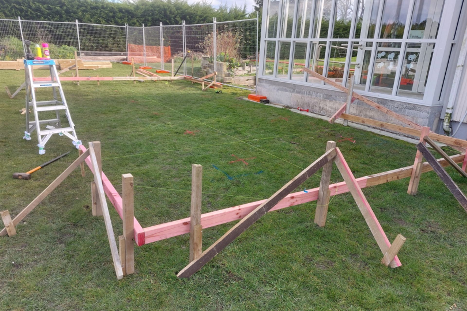 2-Totara-Primary-School-Oamaru-Batter-boards-on-piles-lifted-to-height-required-with-strings-lines-marking-out-where-piles-needed-JDBuilders.jpg