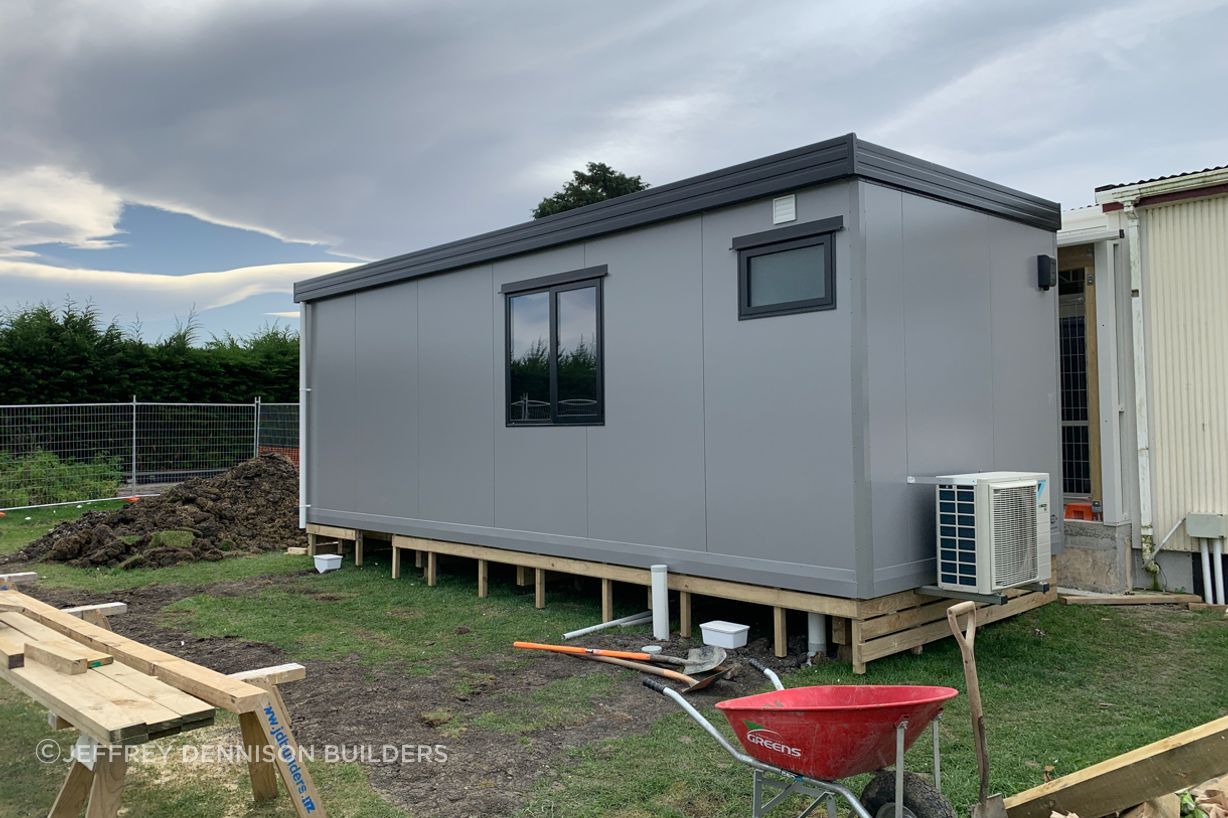 7-Totara-Primary-School-Oamaru-Front-view-of-the-new-learning-space-on-piles-with-heat-pump-being-installed-JDBuildersLR.jpg