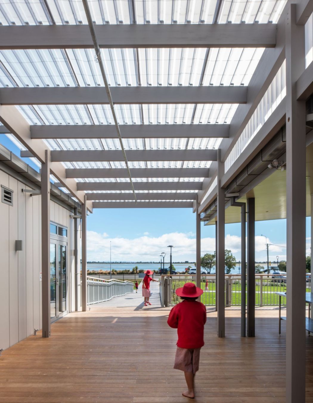 Timber canopies link buildings together, providing shelter and allowing for natural ventilation and open-space corridors.