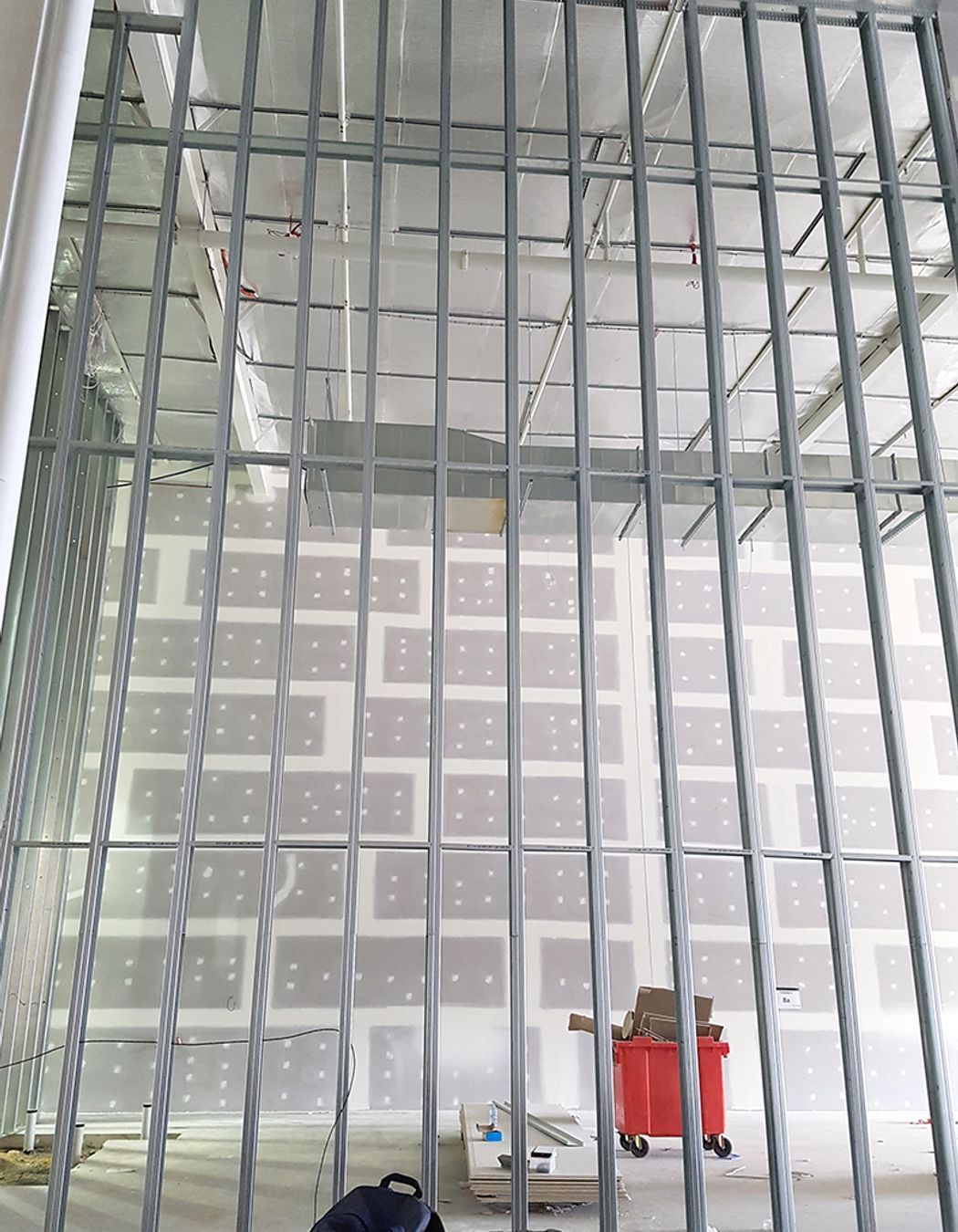 Hoxton-Park-9.5m-Steel-Framing-Noggin-Track 9.5m high internal dividing walls separate the new retail spaces, constructed using Studco steel stud, track and nogging track.