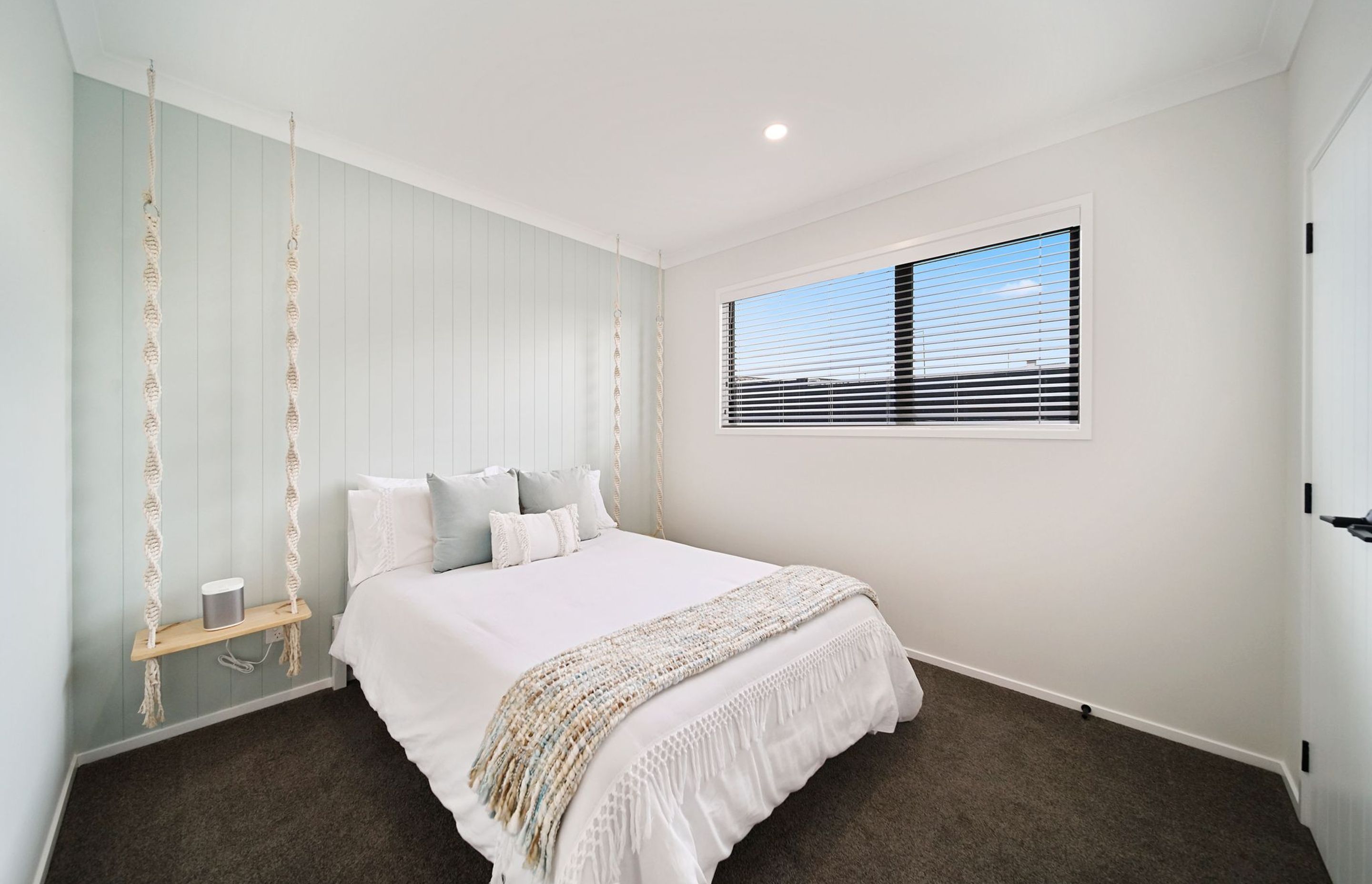 Bedroom with hanging bedside tables