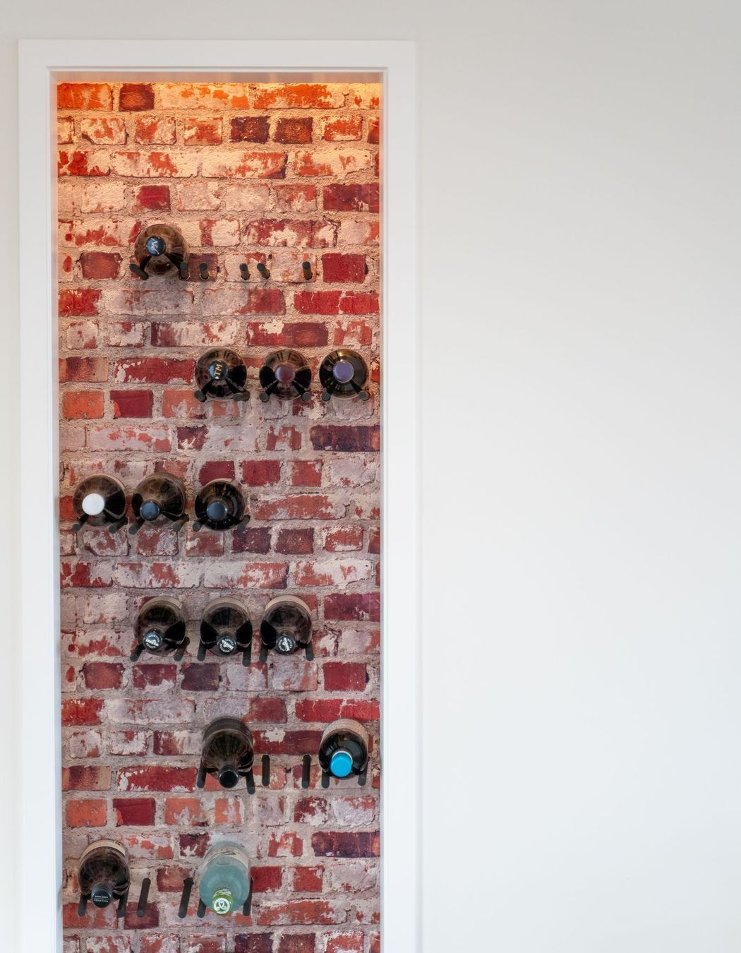 Brick feature wall with wine racks