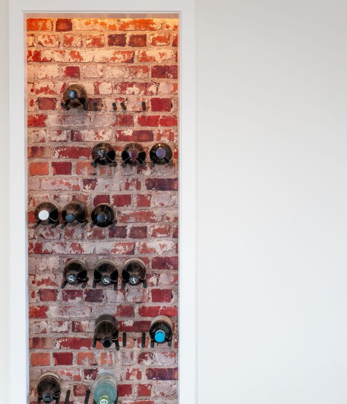 Brick feature wall with wine racks