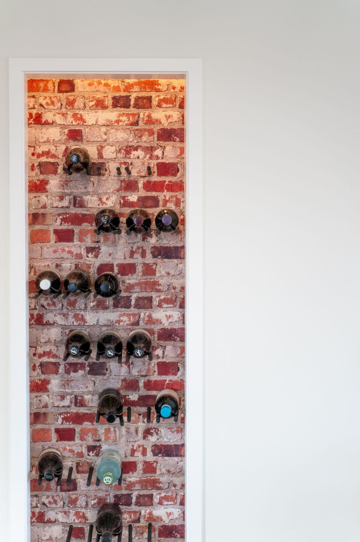 Brick feature wall with wine racks