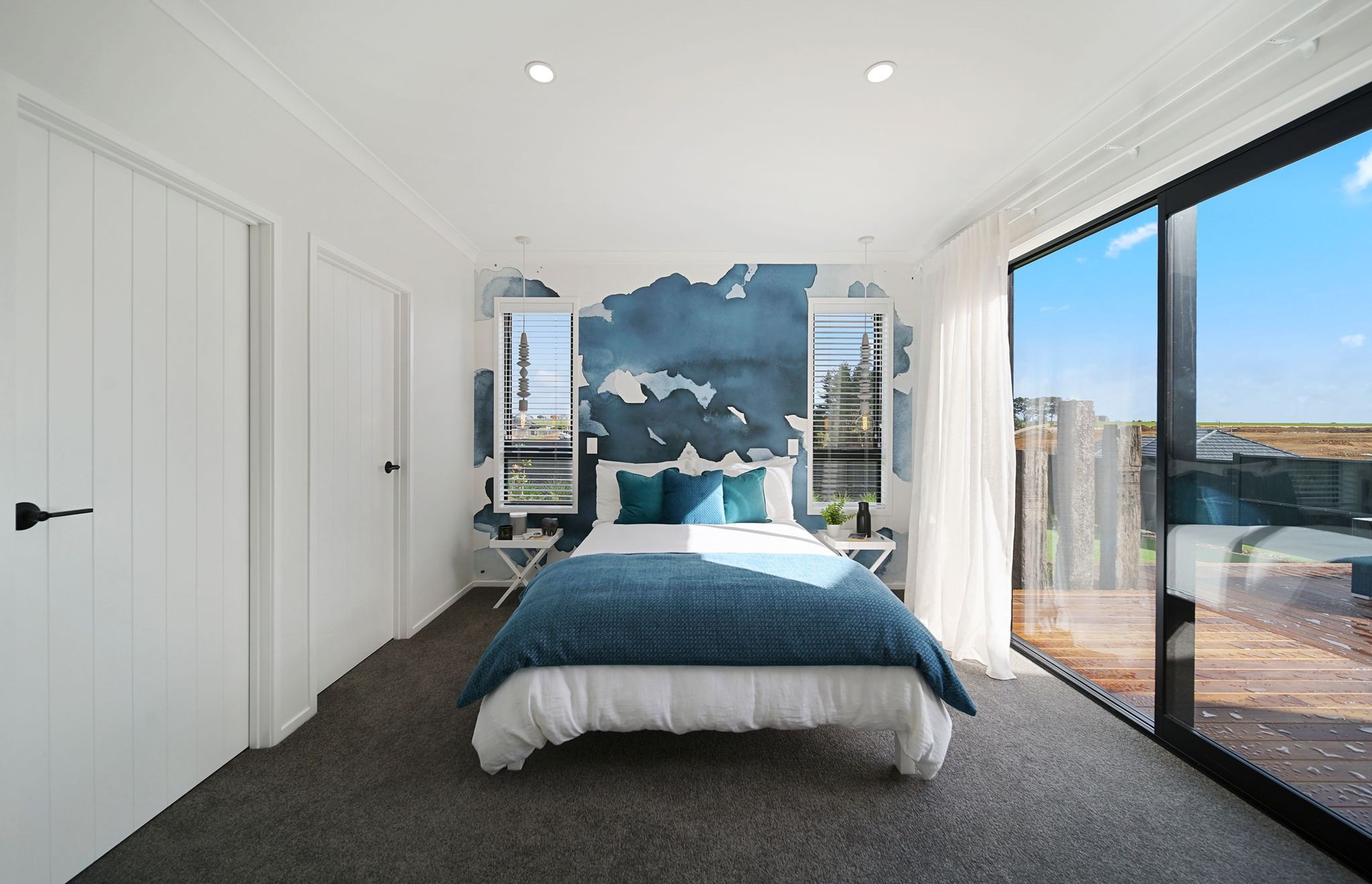 Bedroom with blue water colour feature wall