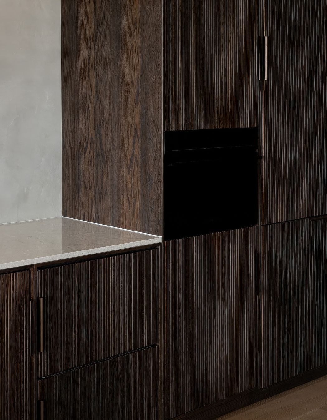 Bespoke fluted-timber cabinetry with intergrated Fisher & Paykel appliances.