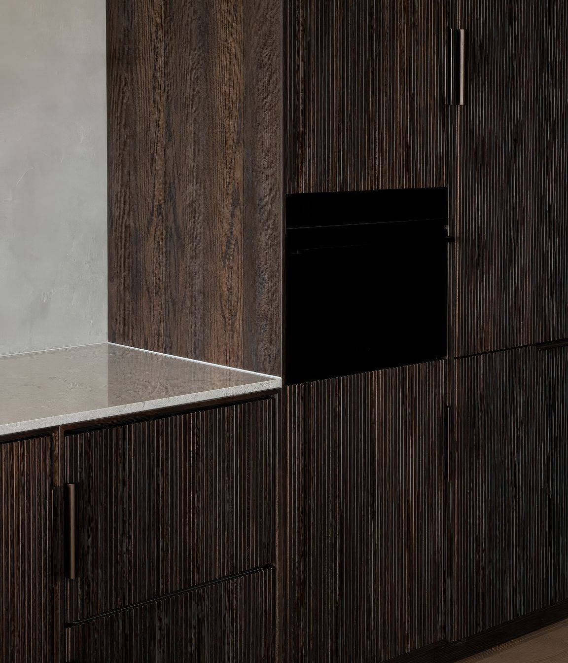 Bespoke fluted-timber cabinetry with intergrated Fisher & Paykel appliances.