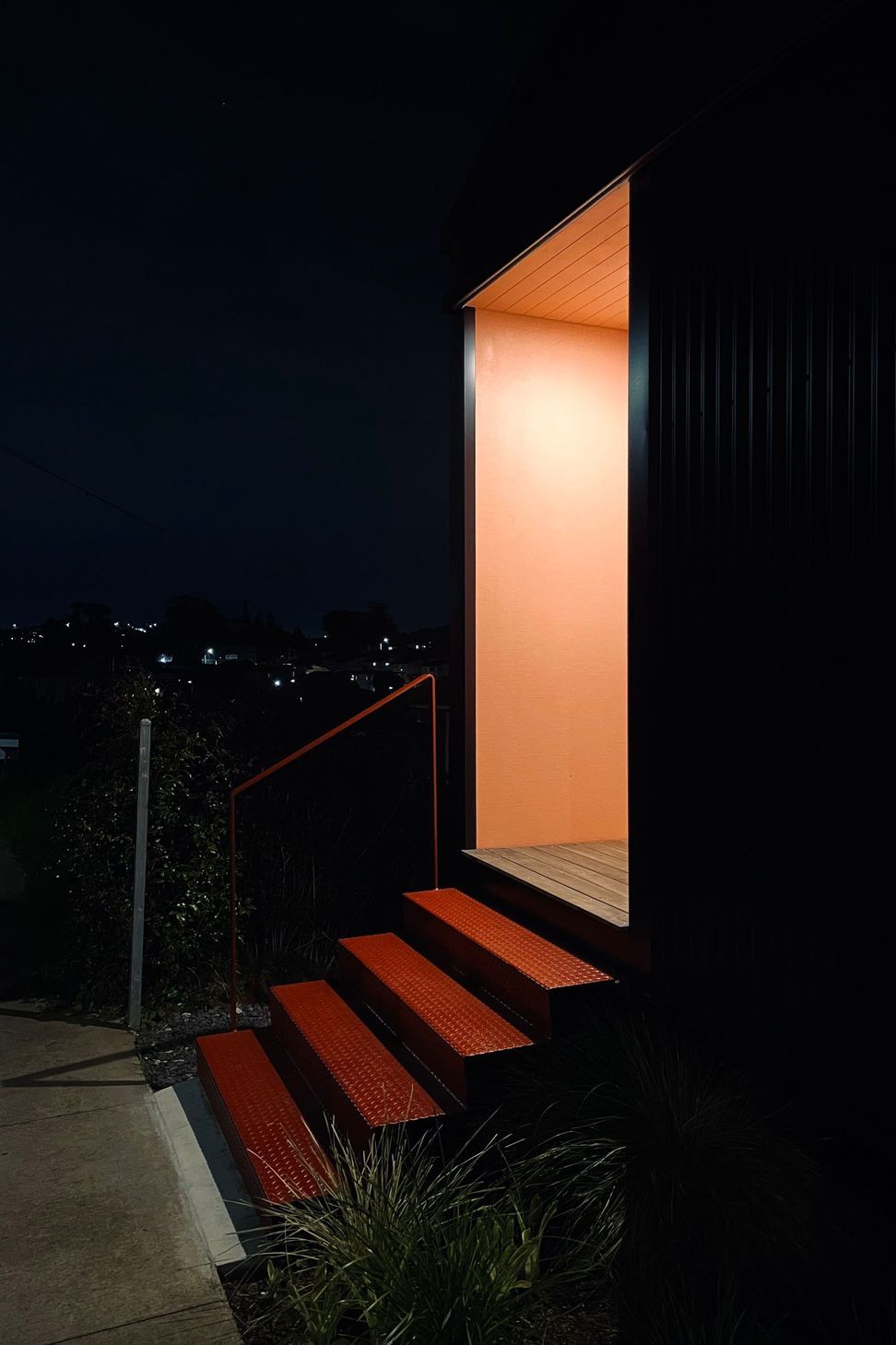 02-Pink-porch-glowing-at-night-time.jpg