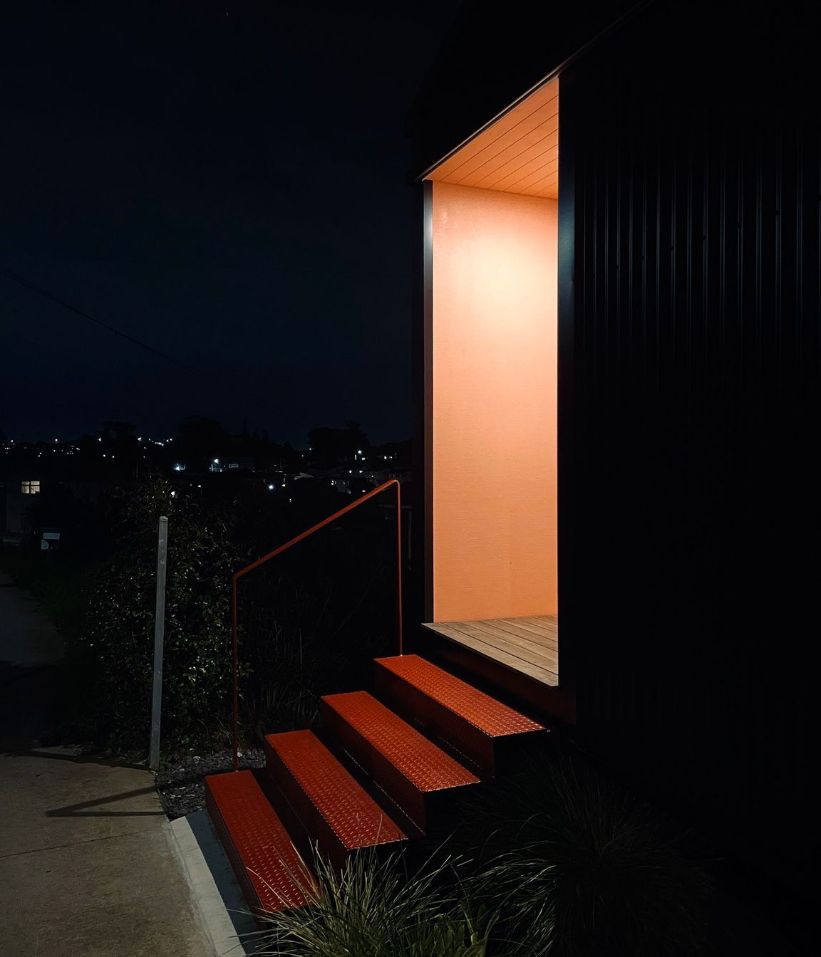 02-Pink-porch-glowing-at-night-time.jpg