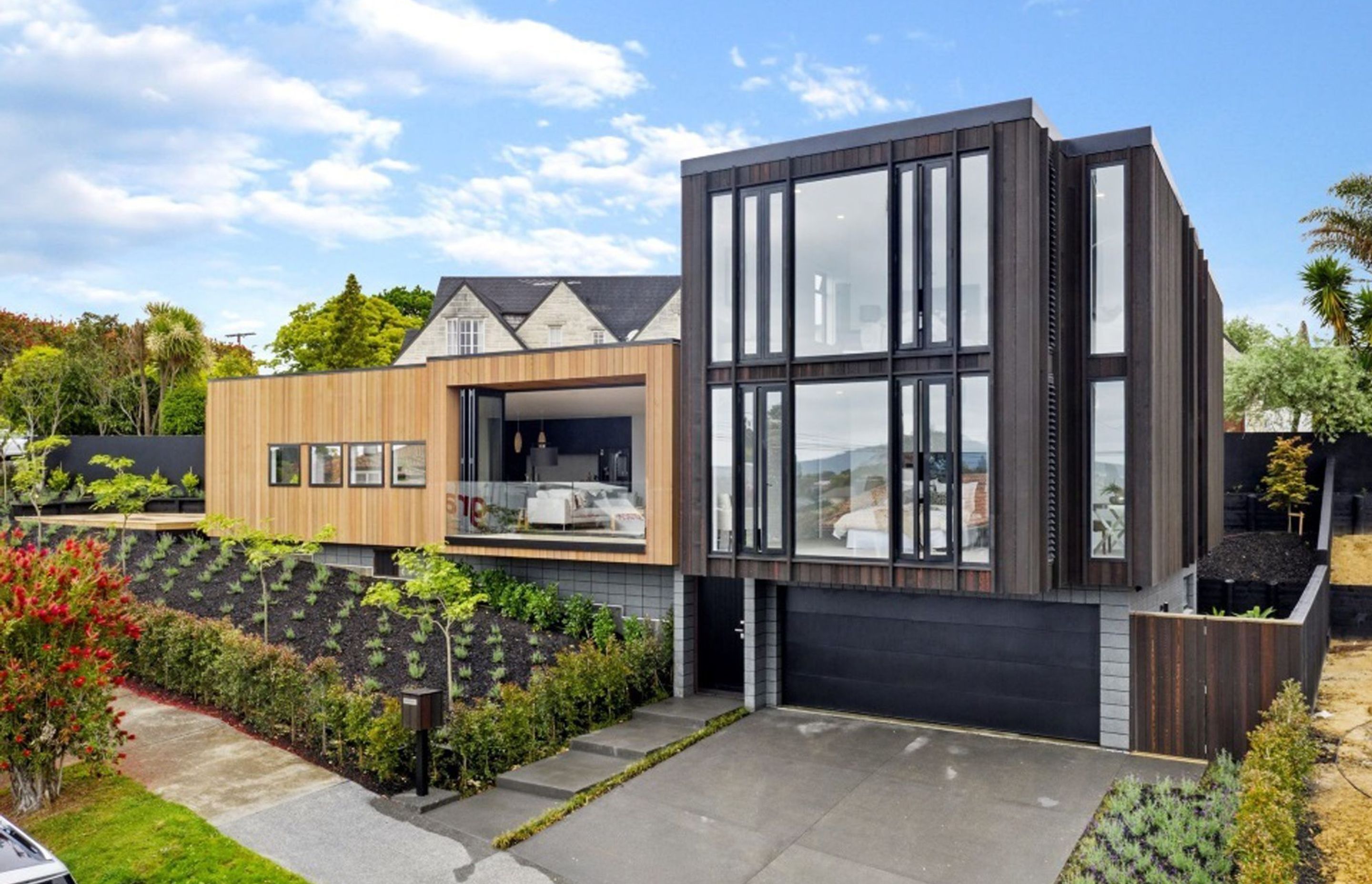 Located in one of Auckland’s more sought after streets, this family home features four bedrooms, four bathrooms, open plan living and front, rear and side decks to take advantage of the view.