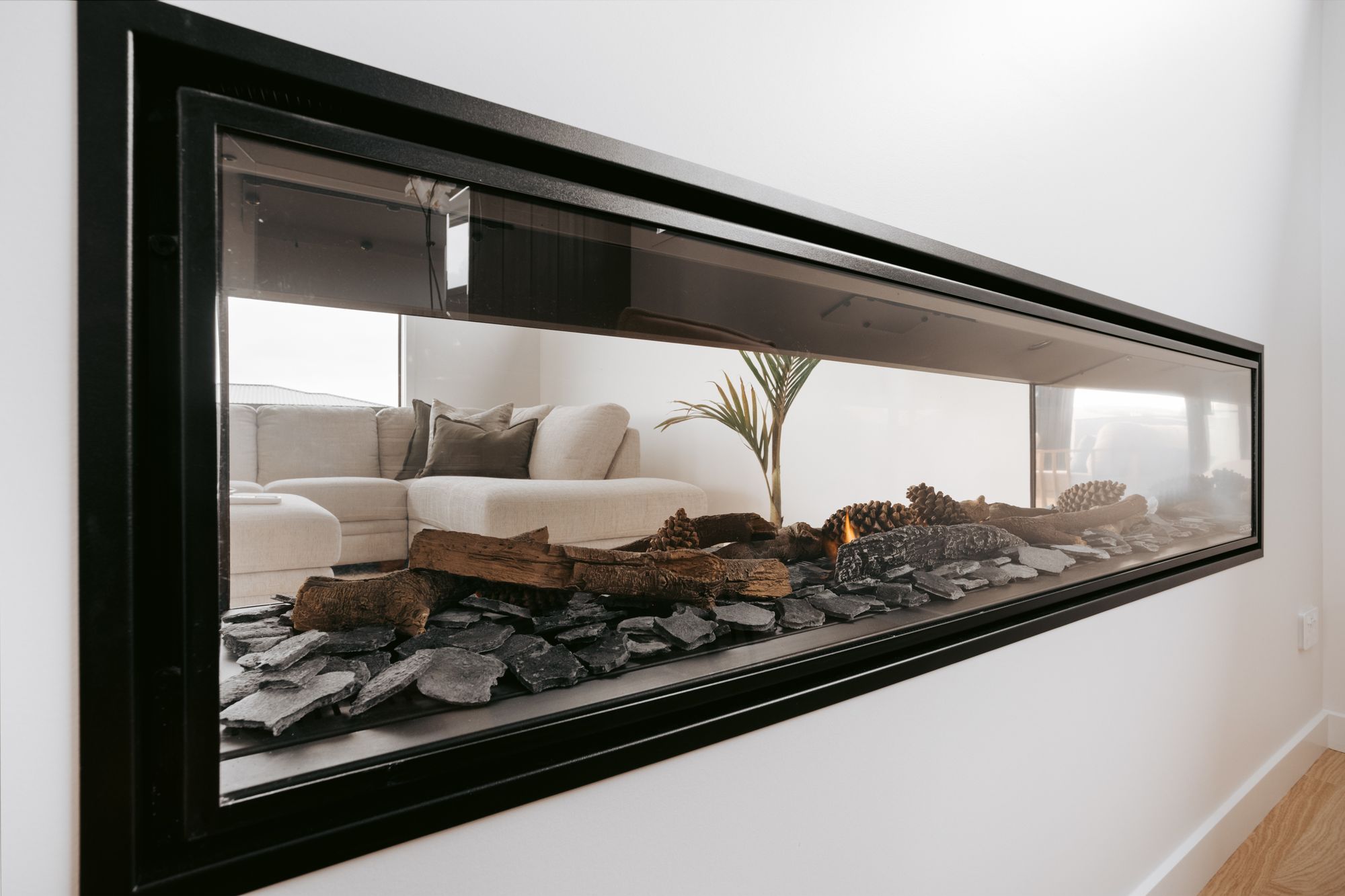 A double-sided fireplace is shared between the lounge and dining room.