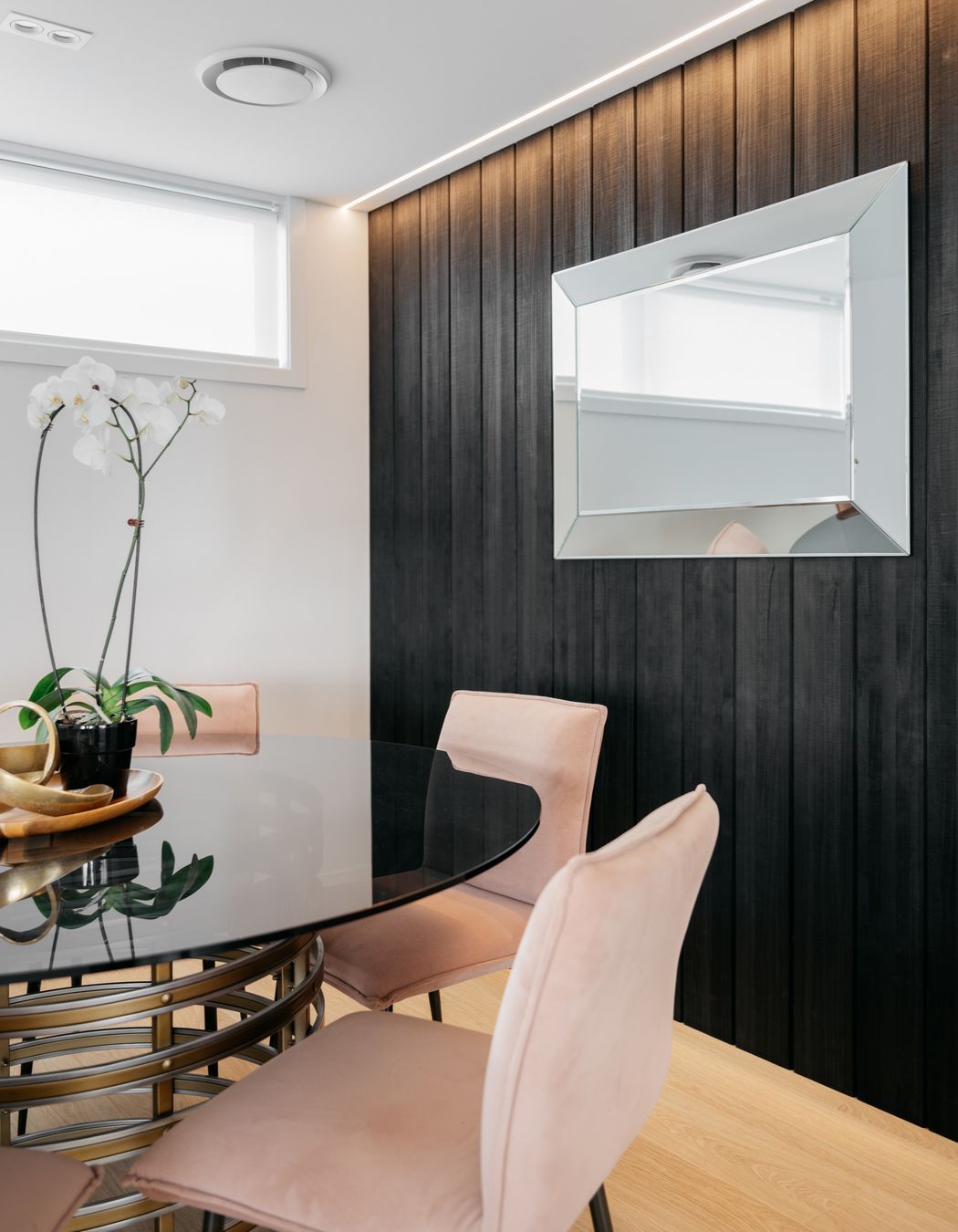 The feature wall is the same colour as the exterior.