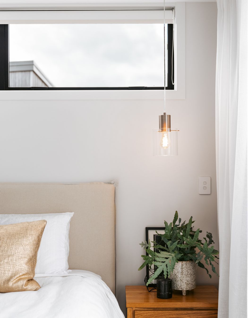 The master bedroom is a calming space with natural colours and textures.