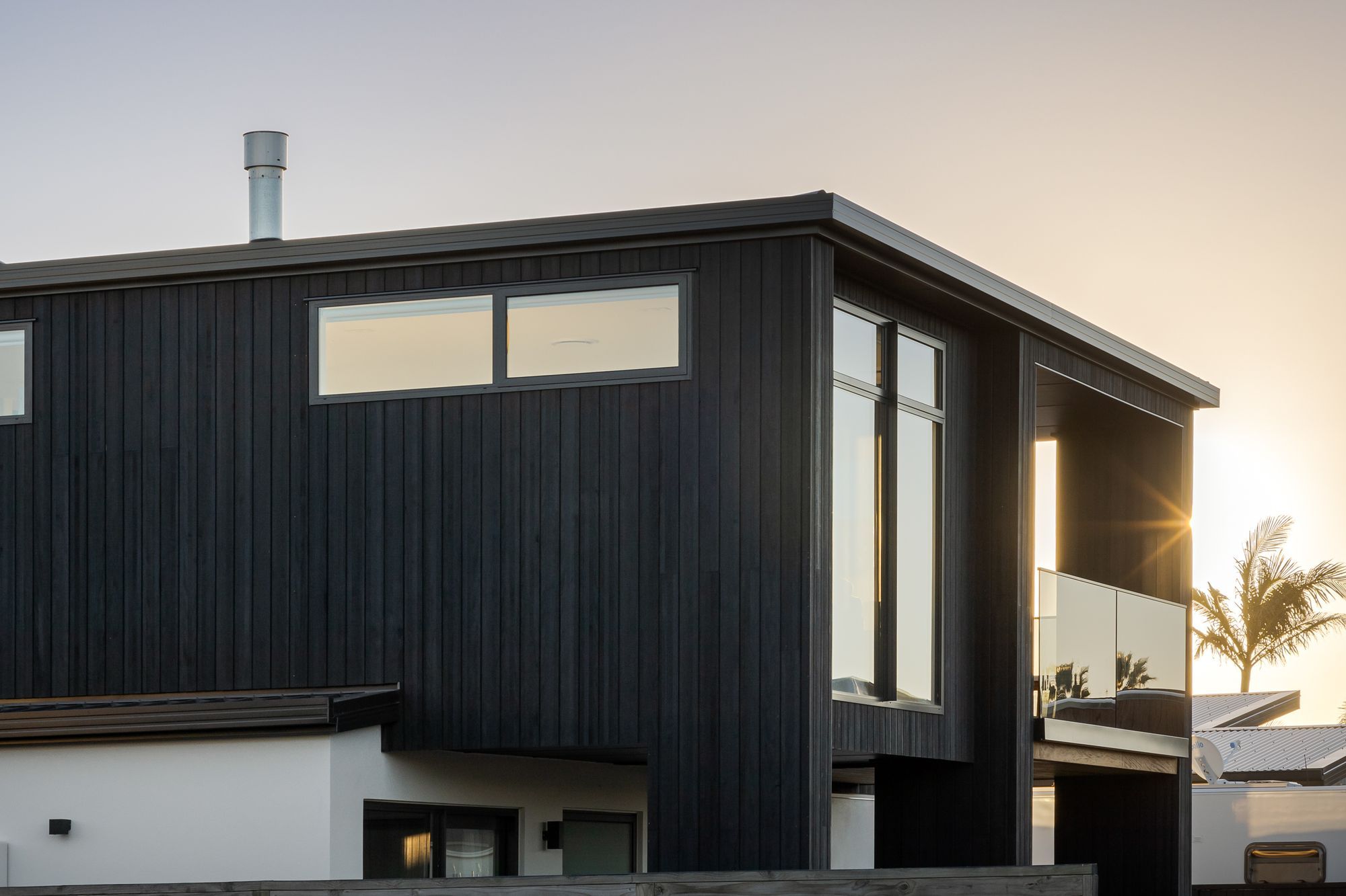 The property borrows the tones and textures of its adjacent beach landscape.