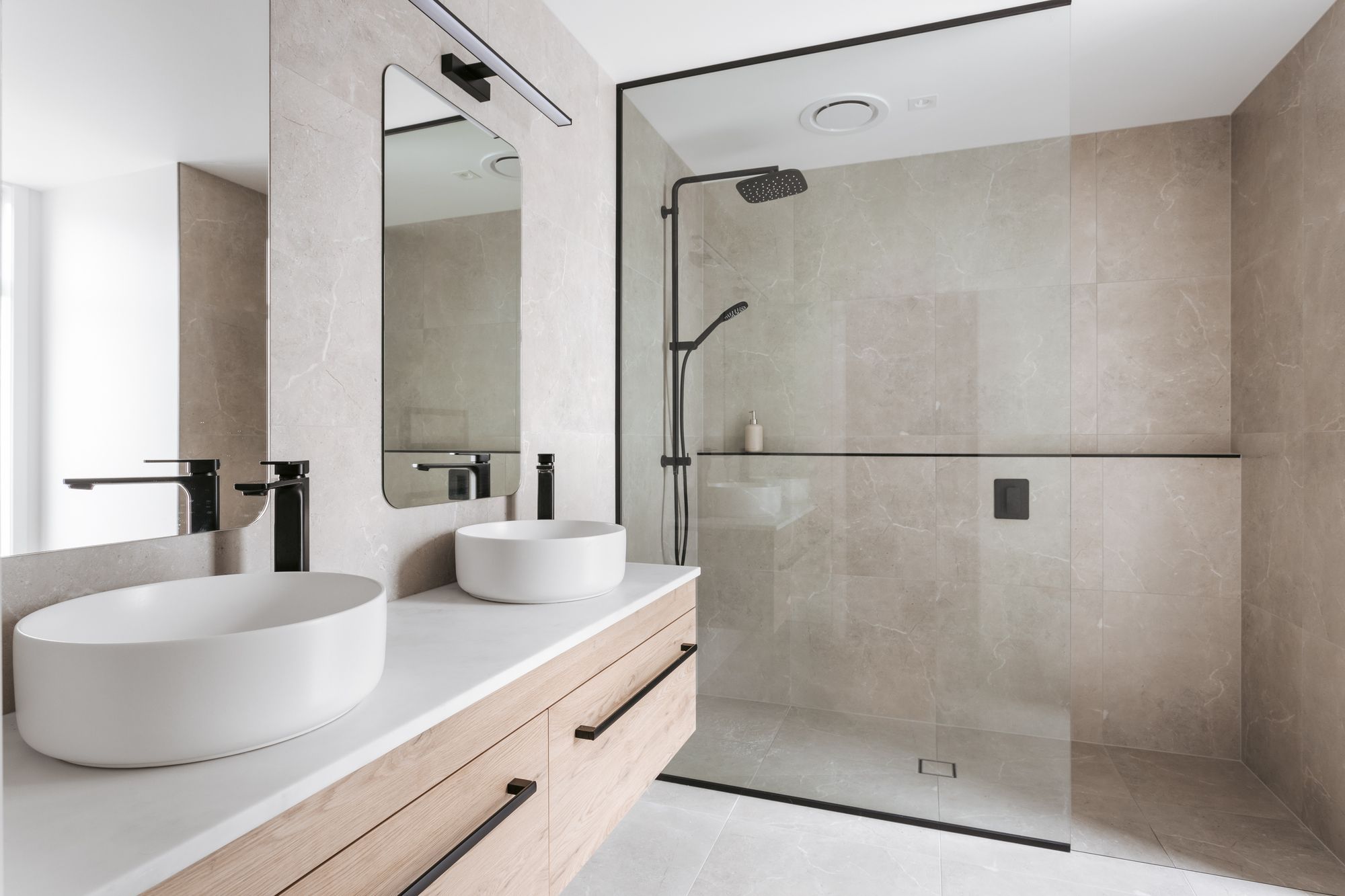 The master ensuite is fitted with double vanities and a walk-in shower.
