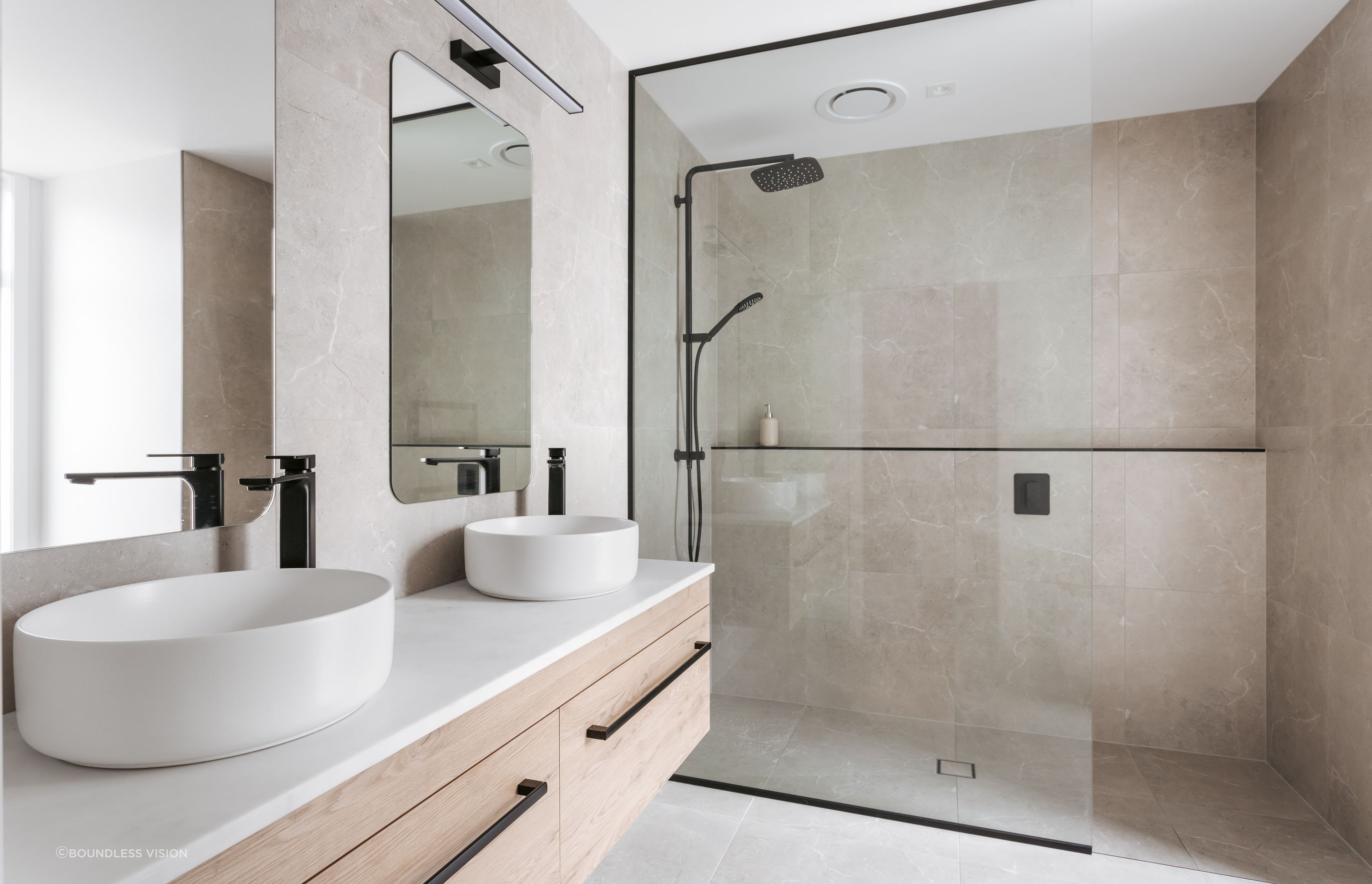 The master ensuite is fitted with double vanities and a walk-in shower.