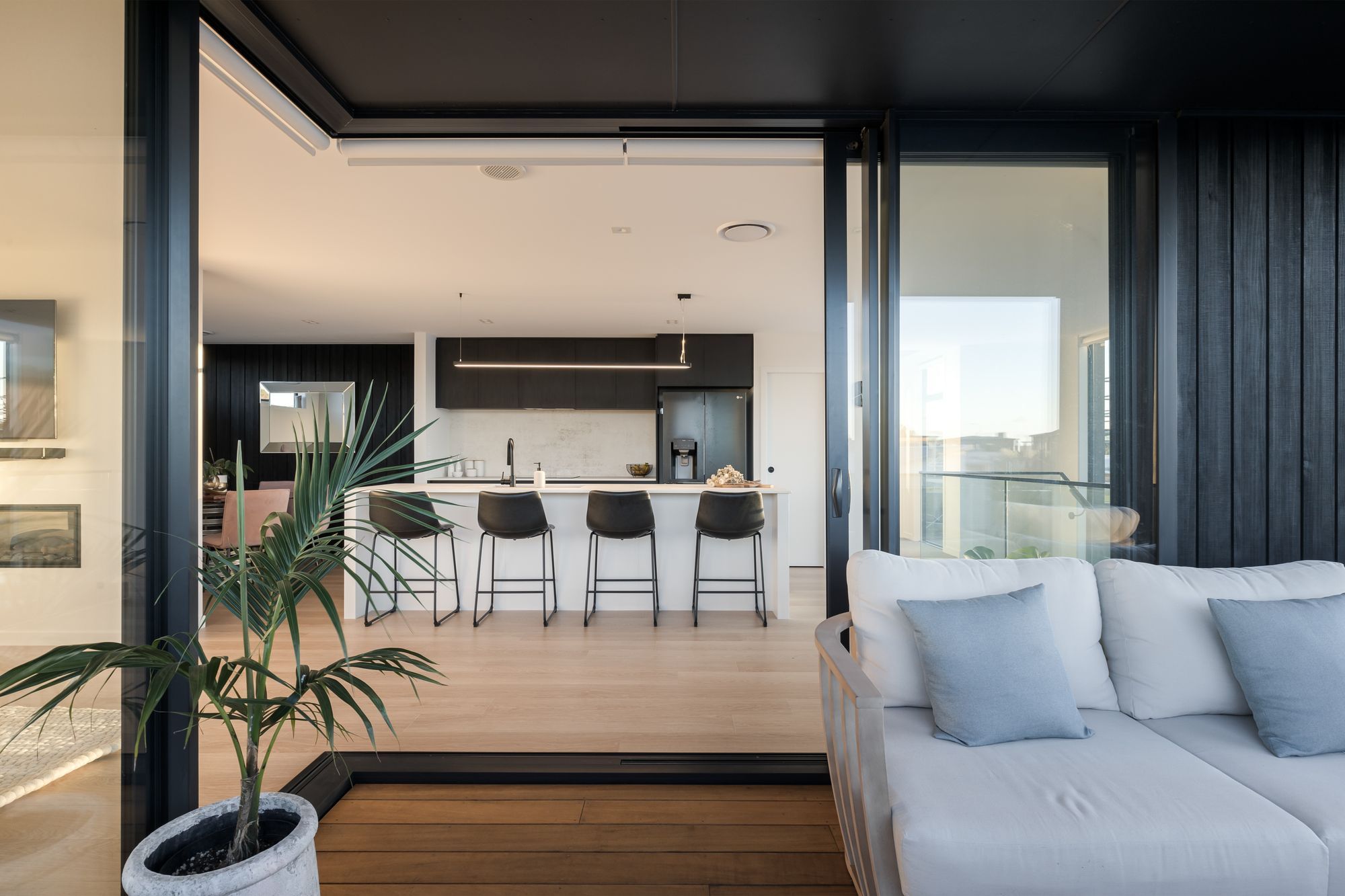 Open-plan living extends out onto the deck.