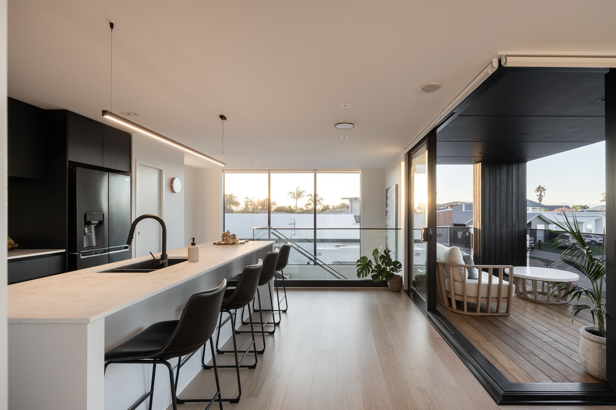 The second storey is perfect for entertaining – complete with indoor-outdoor flow onto a deck overlooking the view.