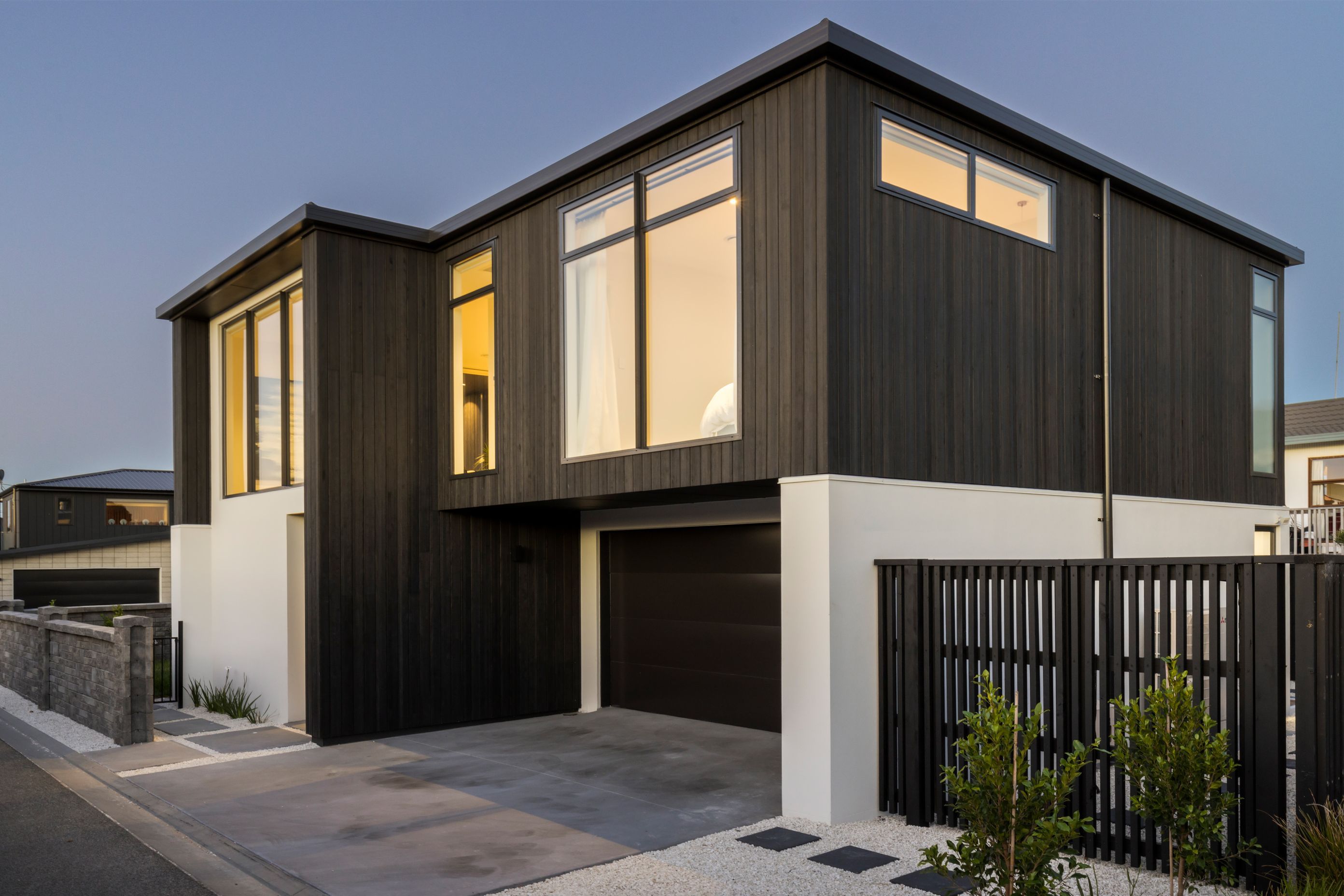 The minimal exterior features only two cladding types.