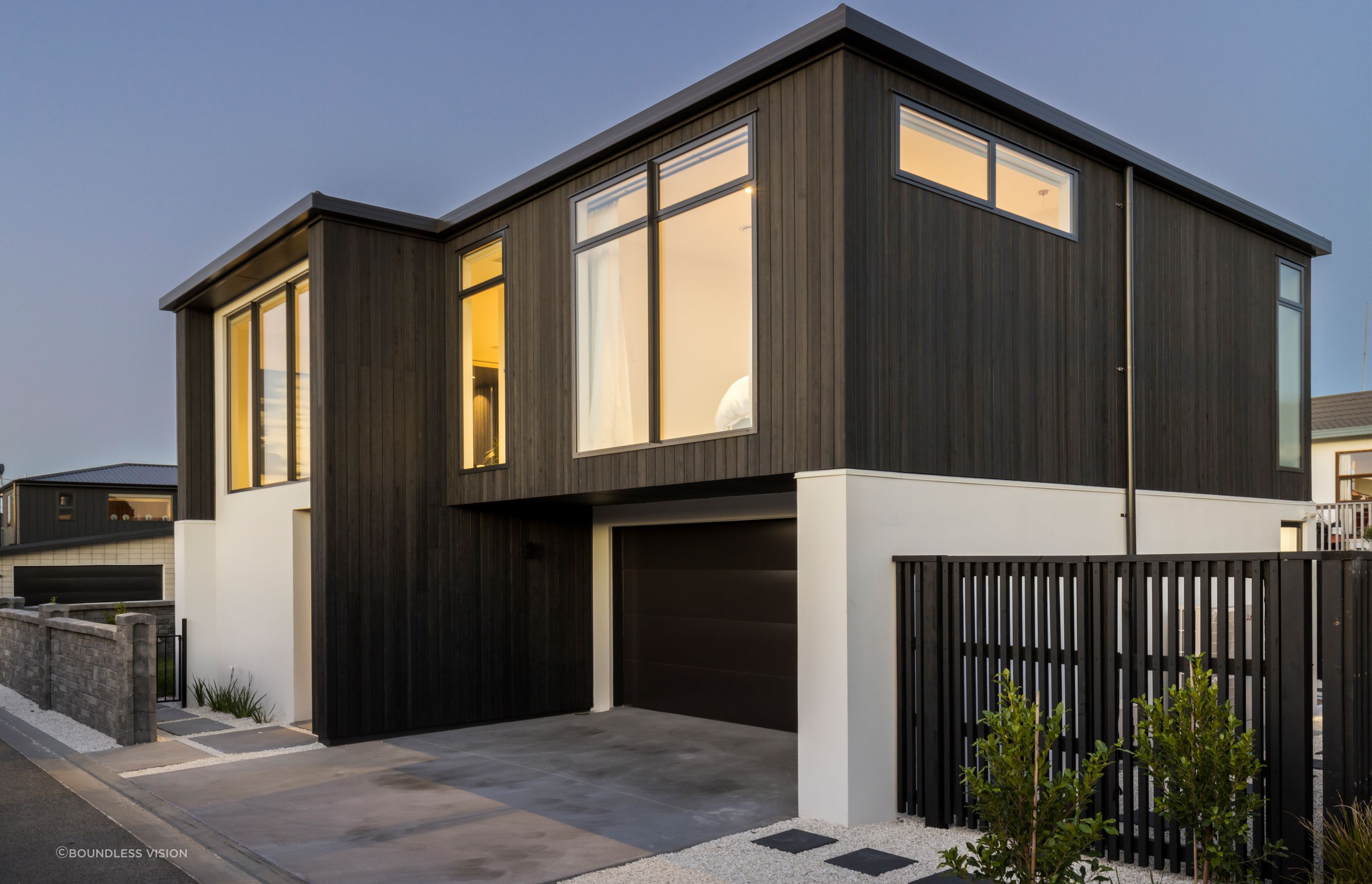 The minimal exterior features only two cladding types.