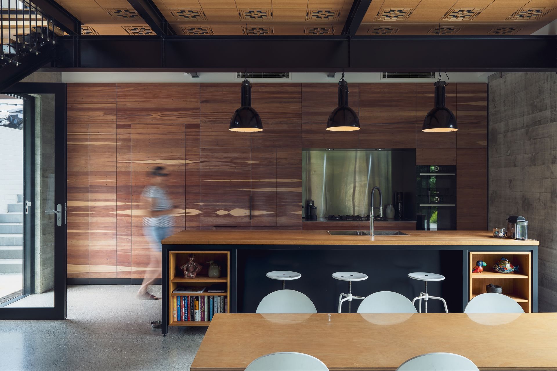 “All this cabinetry is made from the floorboards of the original house. Our cabinetmaker split it so that it's thinner. They set it up in their factory and played with all the pieces to get this really lovely, finished geometry.” A hidden door in the kitchen leads to the master bedroom. “I've always been fascinated by the whole idea of secret doors and the idea that things are happening beyond the obvious."