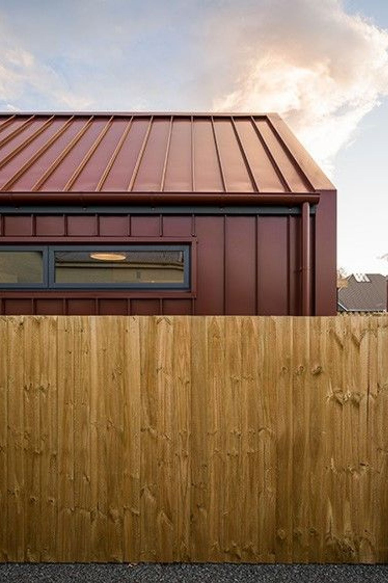 The property has been named Cydonia after the Latin genus for quince, a common fruit in Canterbury and a favourite of the client who makes rich, red quince paste every year—referenced by the colour of the long-run steel cladding.