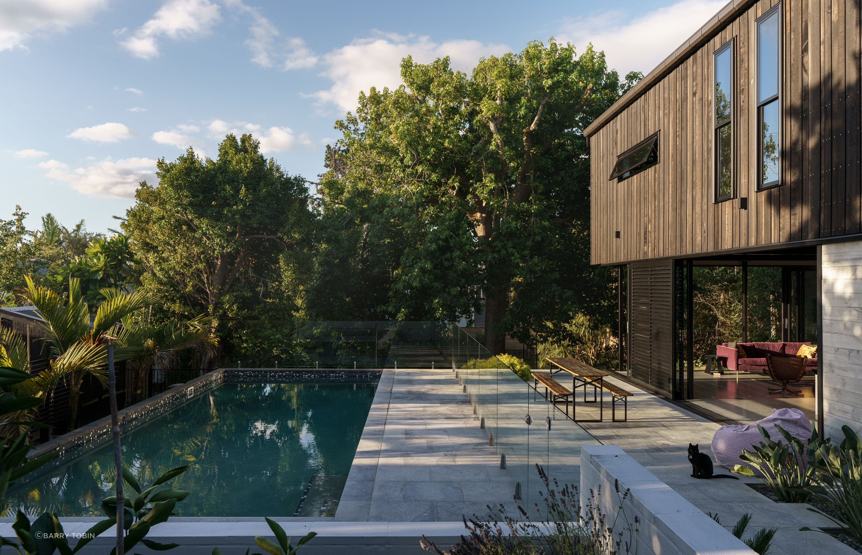 A large site means room for a pool. Landscape is also important and we designed around several existing mature trees, says Clive. “We have an arborist check all our trees on a regular basis, you have to when you get really big mature trees.”