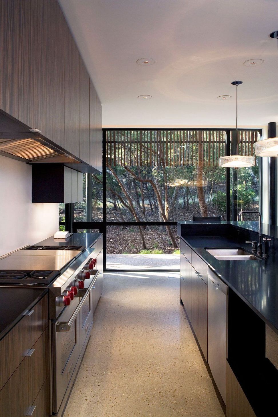 11HouseinTreesCuppettKilpatrickArchitectureandInteriorDesignaustin-tx-modern-kitchen-stainless-steel-terazzo-floor-1.jpg