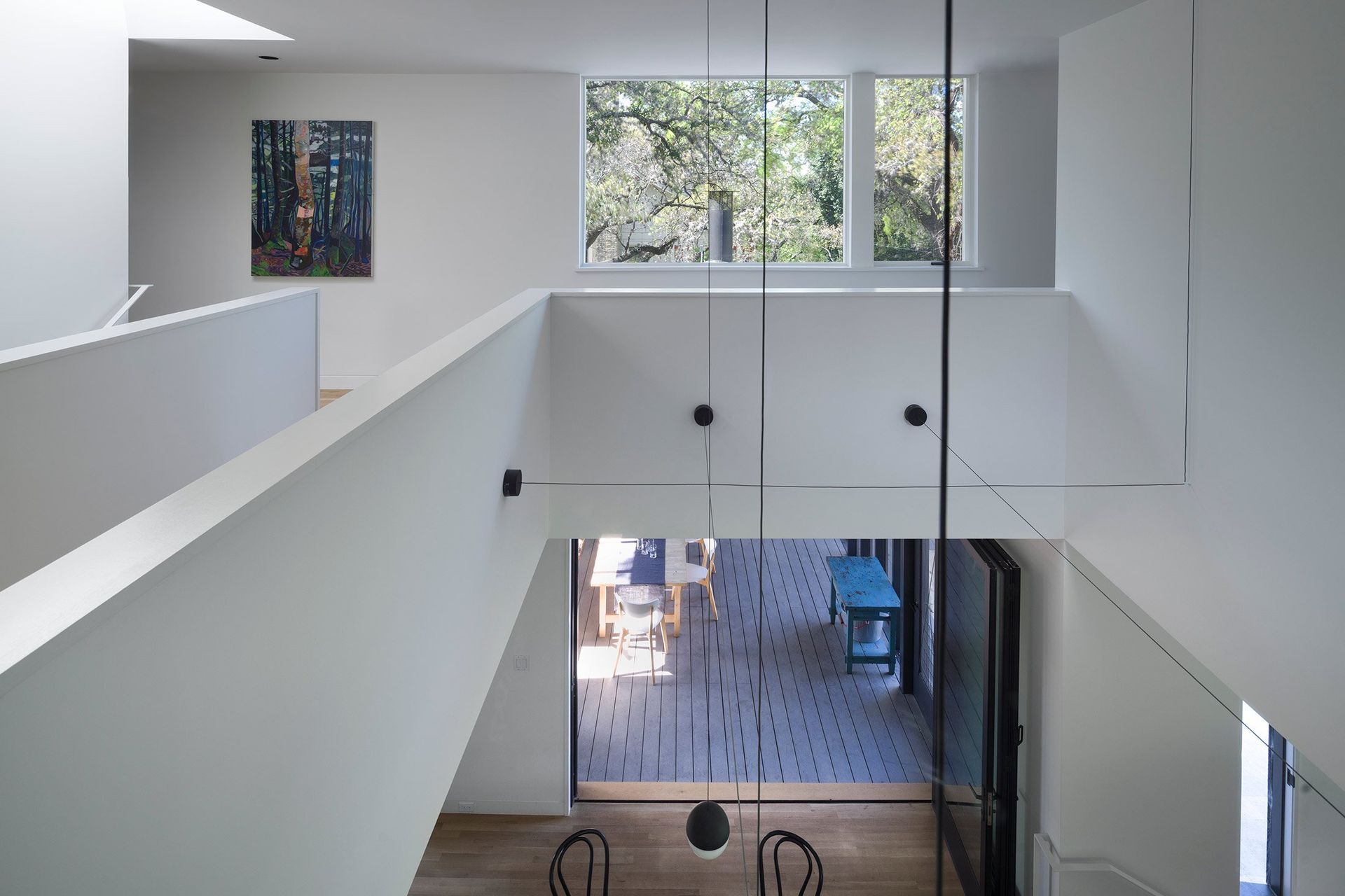 13HillsideCuppettKilpatrickArchitectureandInteriorDesignaustin-tx-modern-dining-double-height-large-folding-doors.jpg