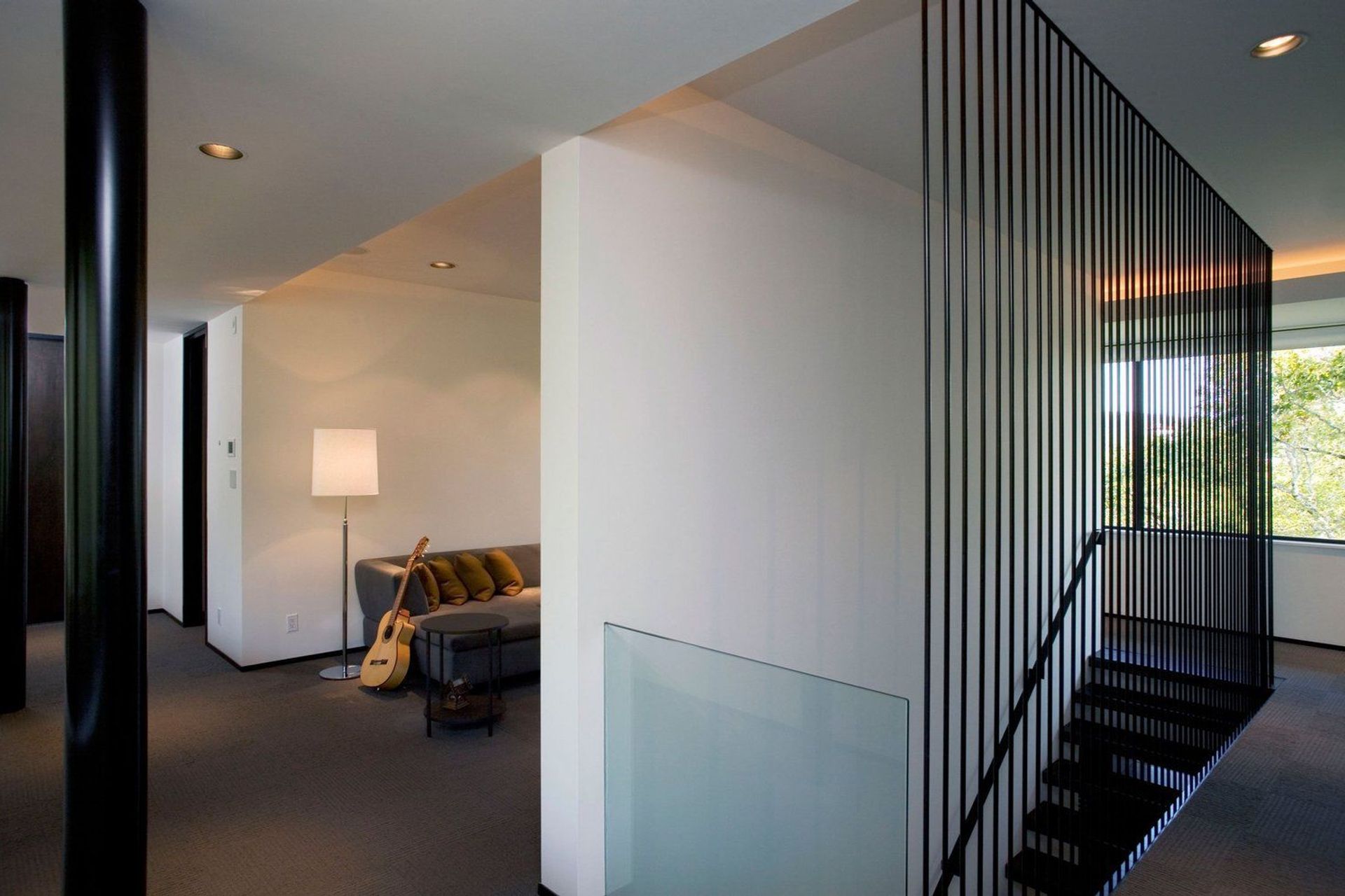 14HouseinTreesCuppettKilpatrickArchitectureandInteriorDesignaustin-tx-staircase-glass-guardrail-modern-design.jpg