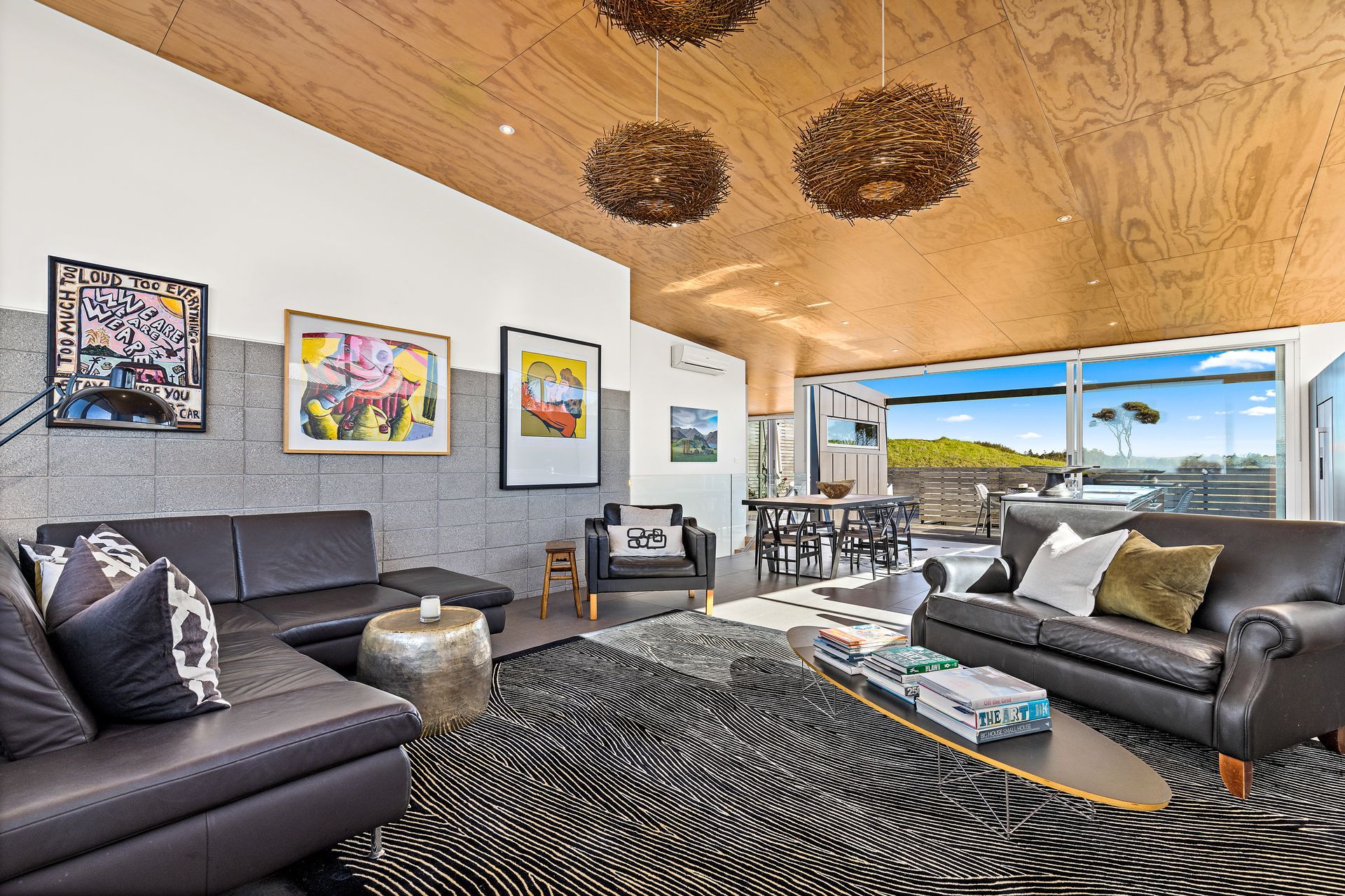 Living Room with Golf Course vista with stack bonded masonry wall feature                                                     Photo Credit:Amy Jenkins/Glasshouse Photography
