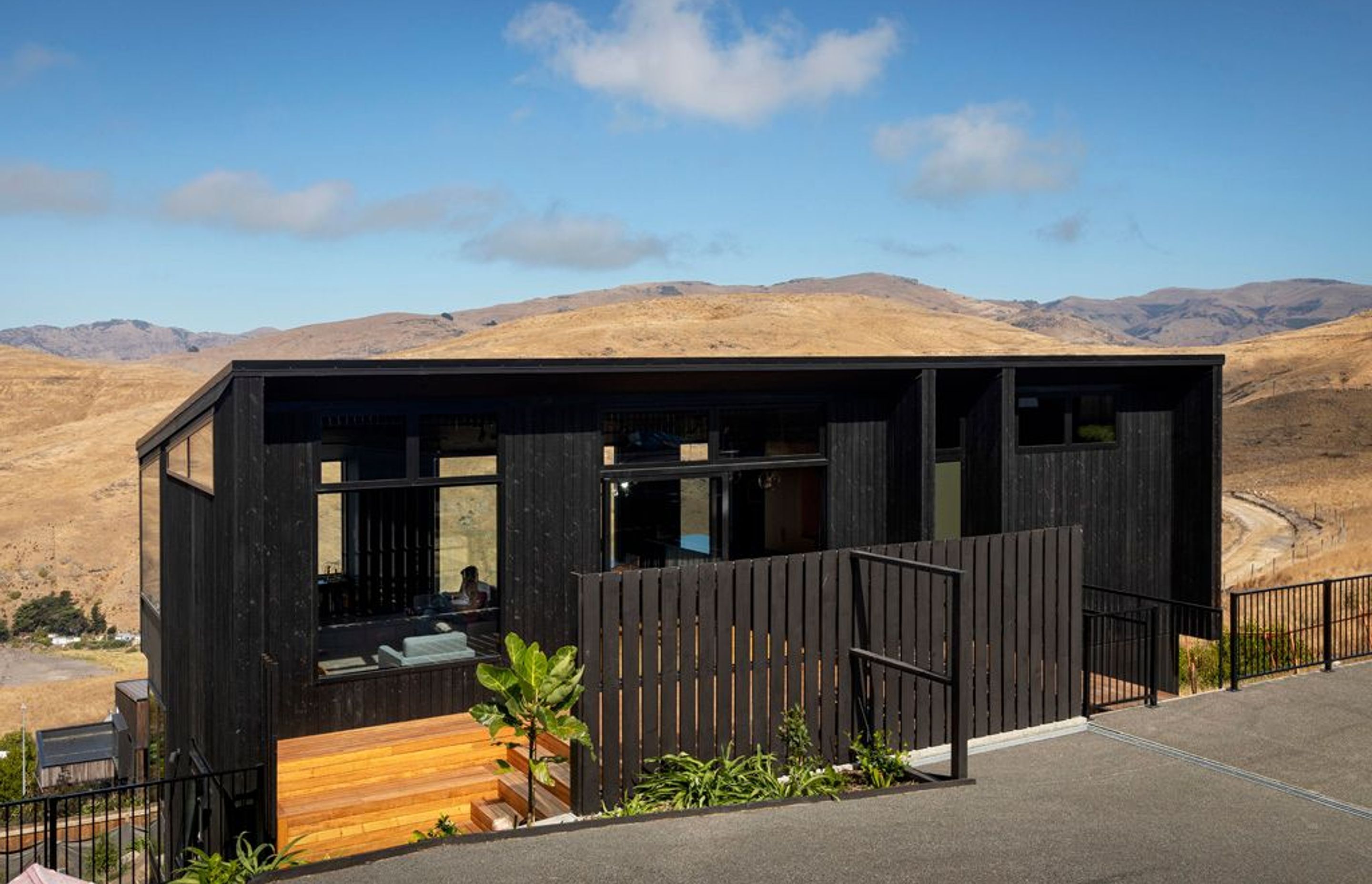 Situated on a steeply sloping site on the northern Banks Peninsula, this house was designed to sit lightly on the land.