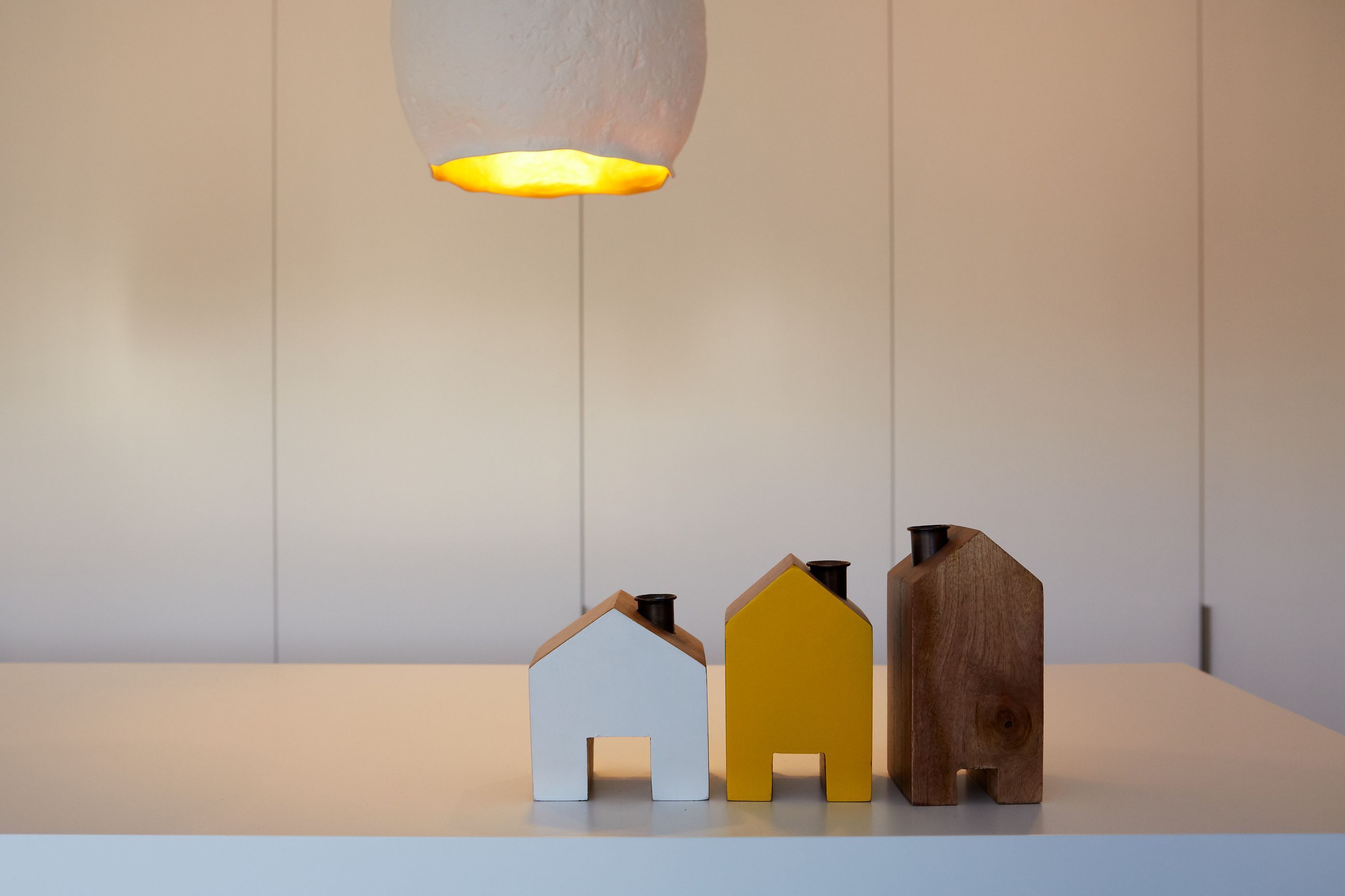 Shades of yellow, white and natural timber are repeating themes throughout the home.