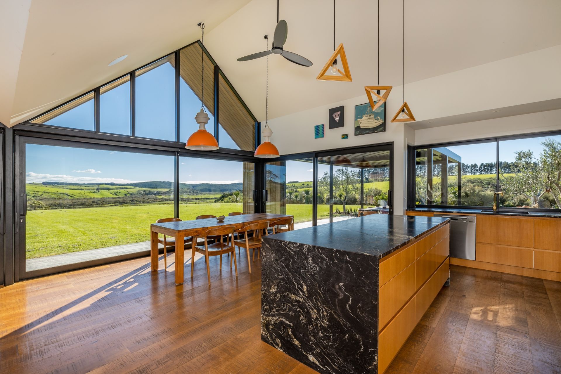 The vaulted ceiling forms and floor-to-ceiling glazing ensure attention is firmly on the view and the connection to the outdoors.