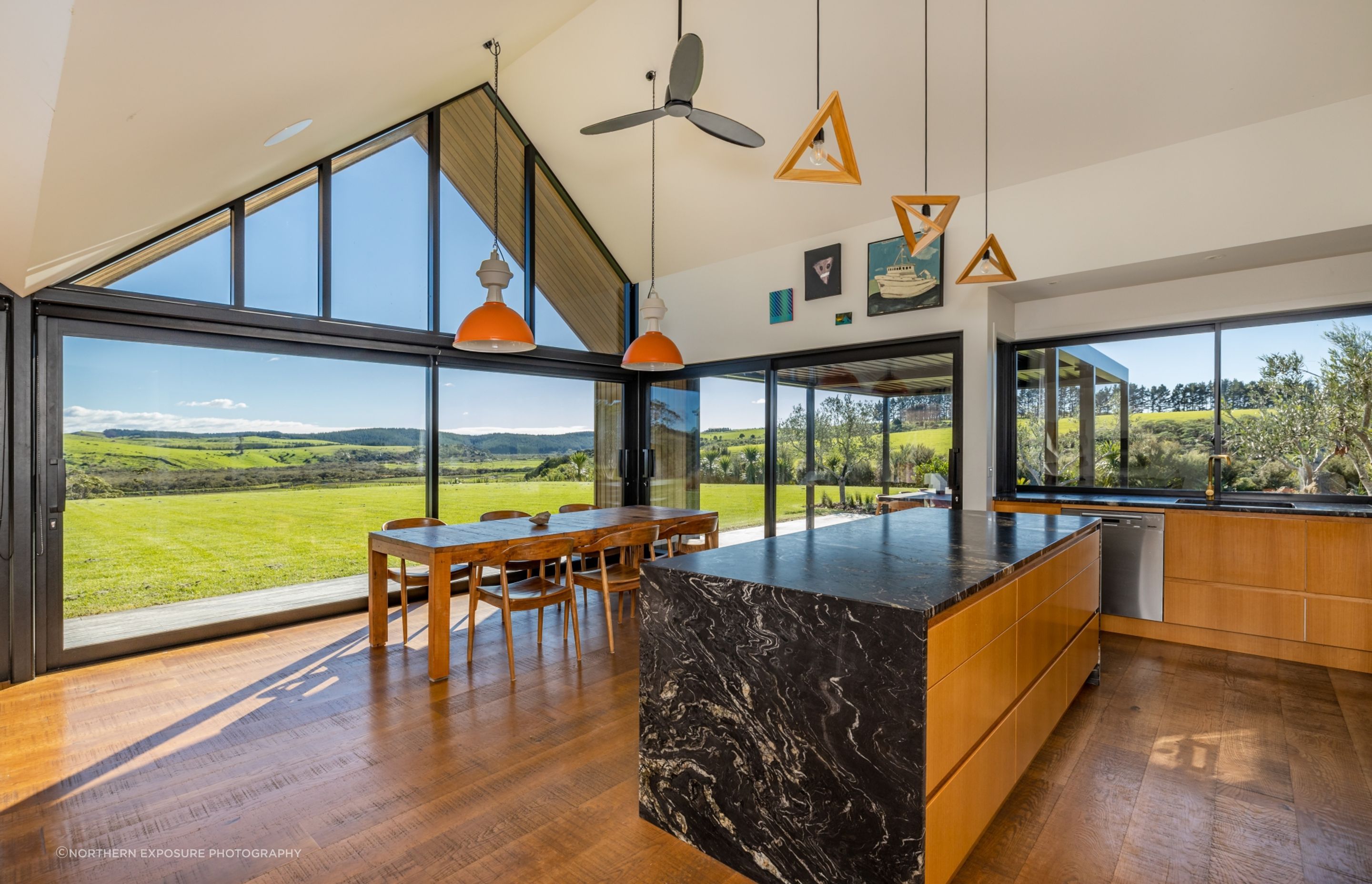 The vaulted ceiling forms and floor-to-ceiling glazing ensure attention is firmly on the view and the connection to the outdoors.