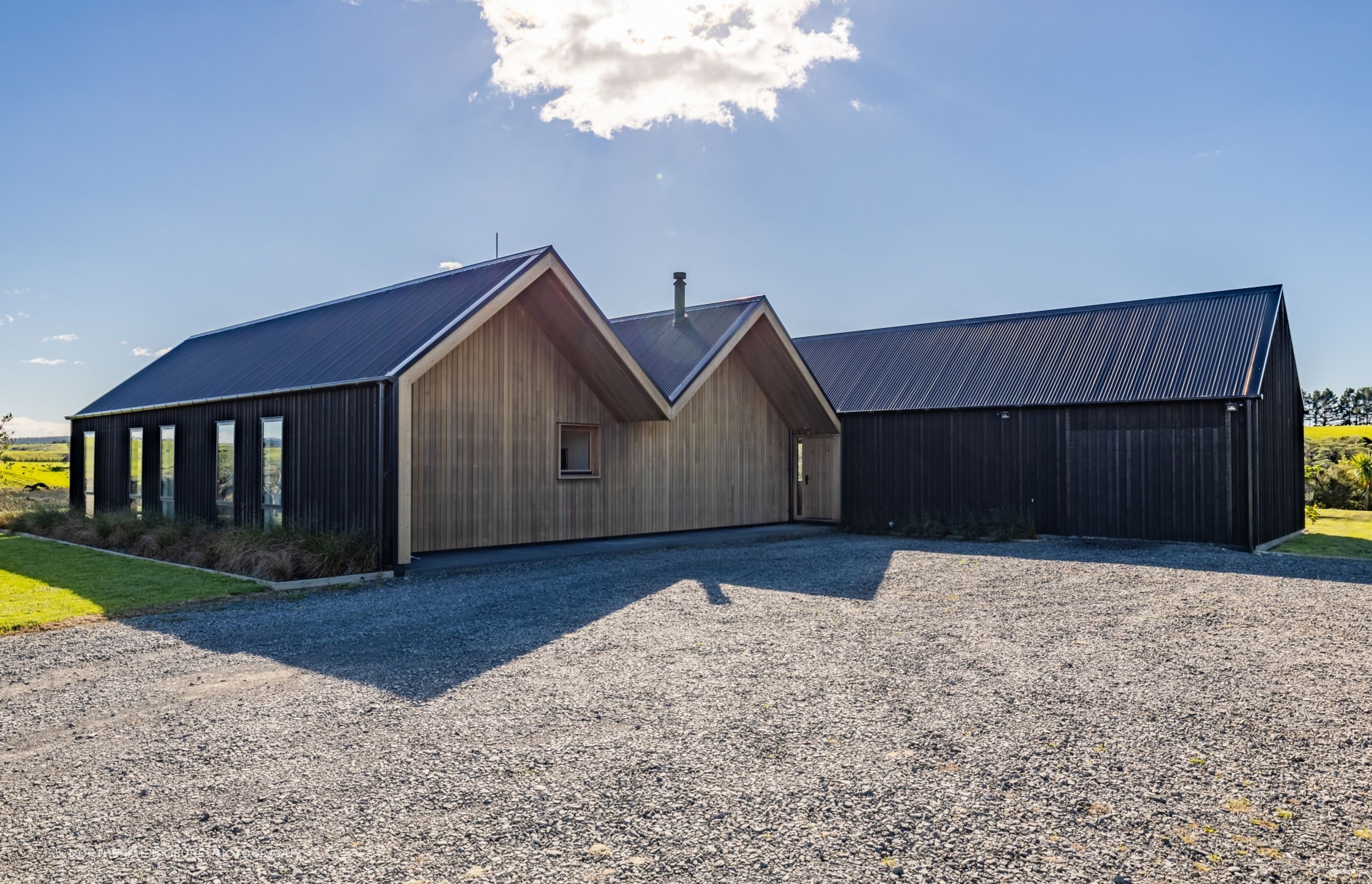 The clients had a specific desire for a repeating gable form and for a building that, "on approach, is not obviously a dwelling, perhaps appearing to be a farm building."