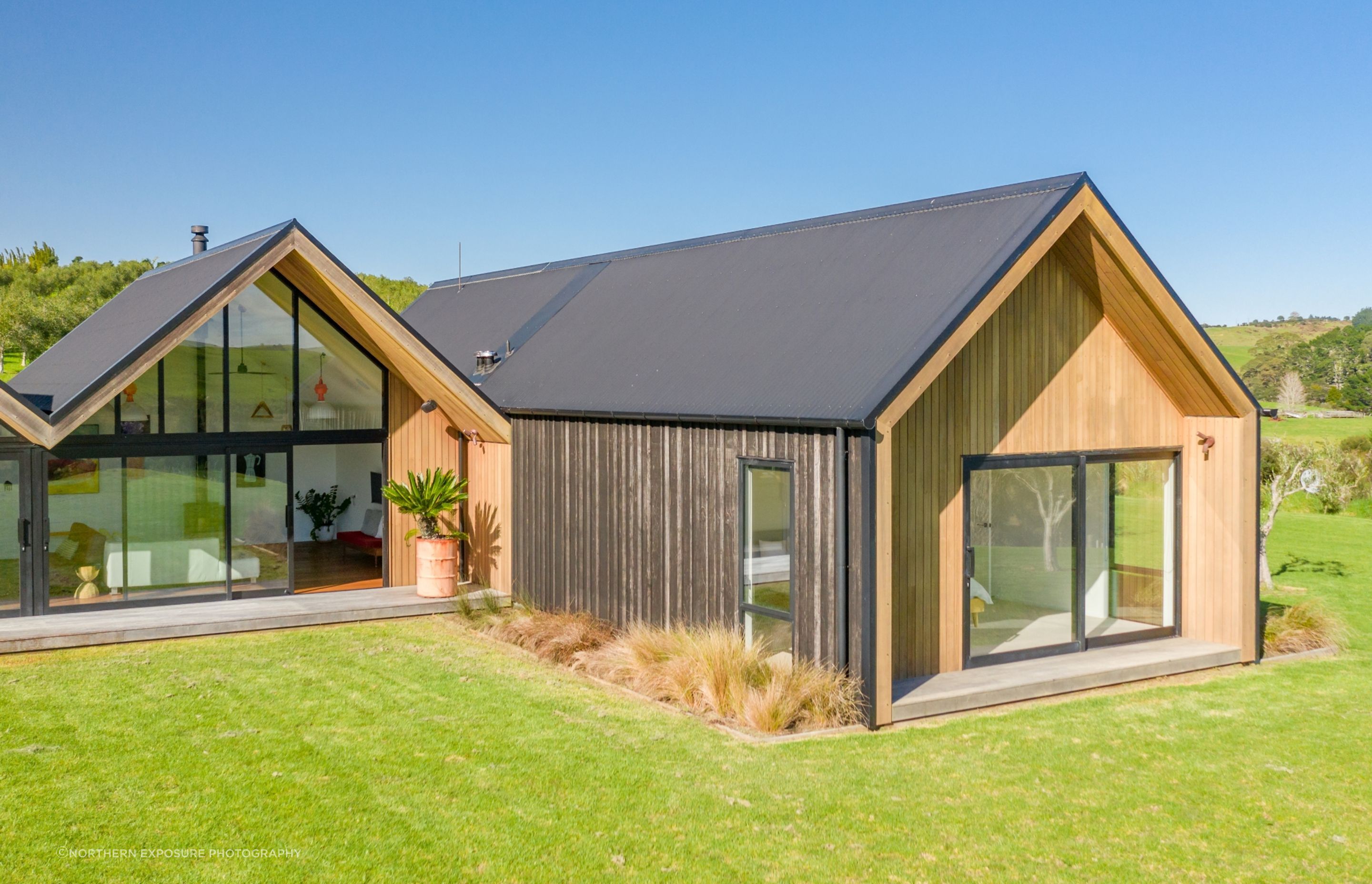 Areas of board and batten offset with cedar help give the building the 'farm building' quality the owners asked for.