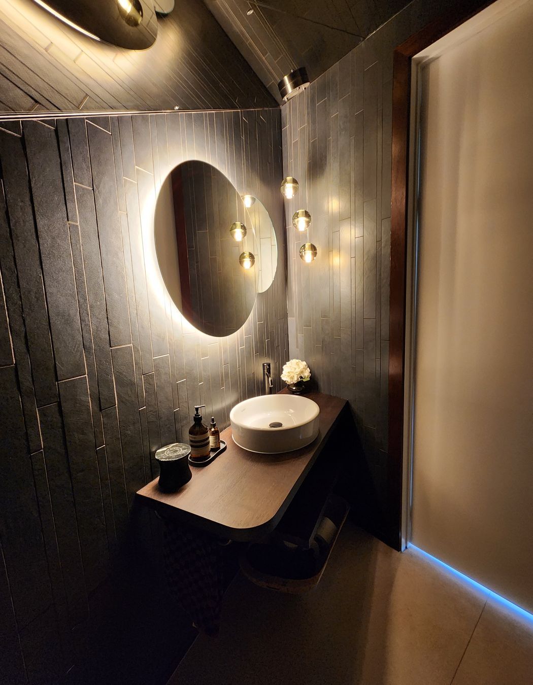3-Powder-Room-designed-by-Aveora-Products-used-Switch-Lighting-Lutron-Electronics-automated-lighting-Bocchi-pendant-from-ECC.jpg