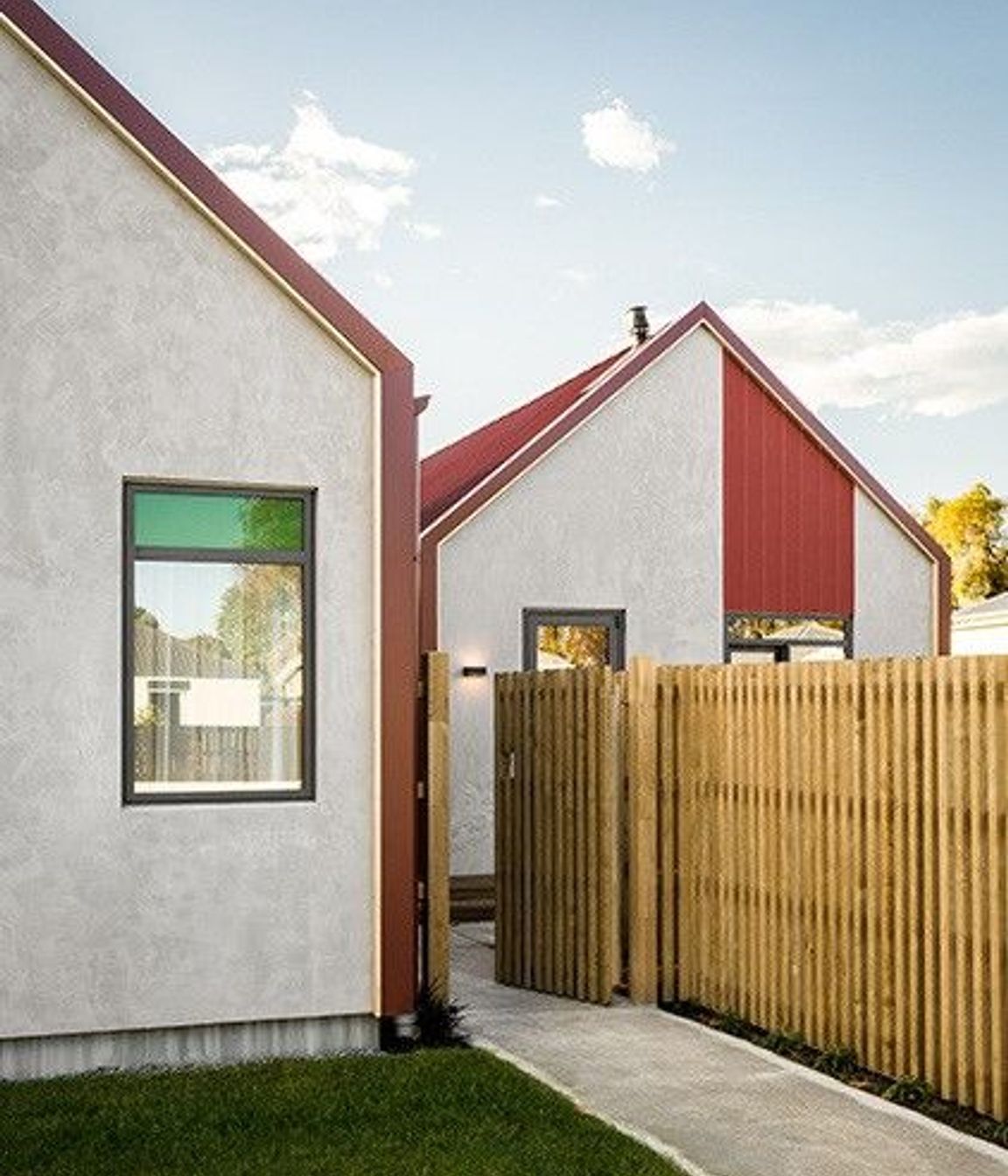 The gable ends are constructed from a lightweight concrete panel system with a concrete plaster finish.