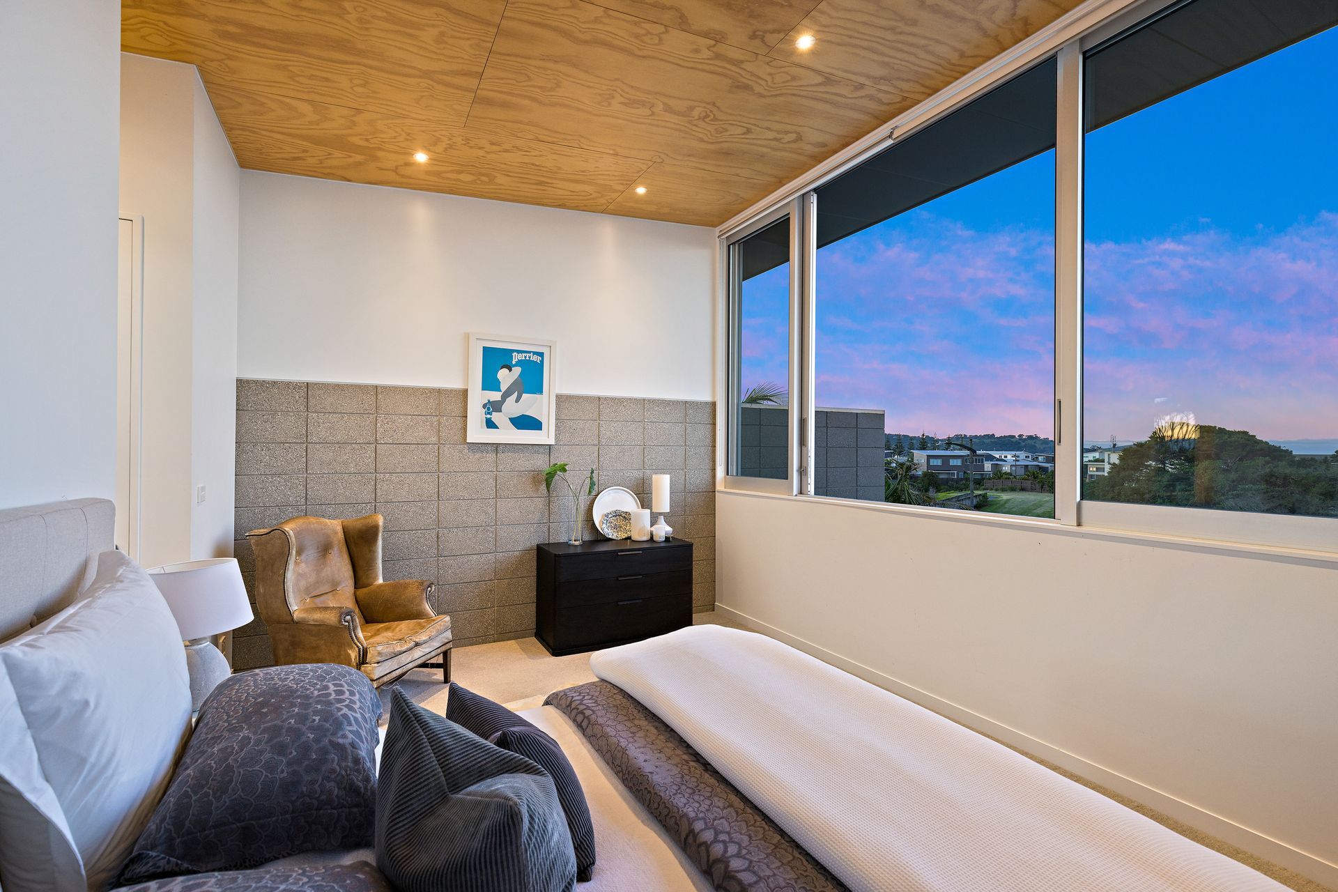 Master Bedroom and a clever private sitting space enjoy Living room features. Photo Credit:Amy Jenkins/Glasshouse Photography