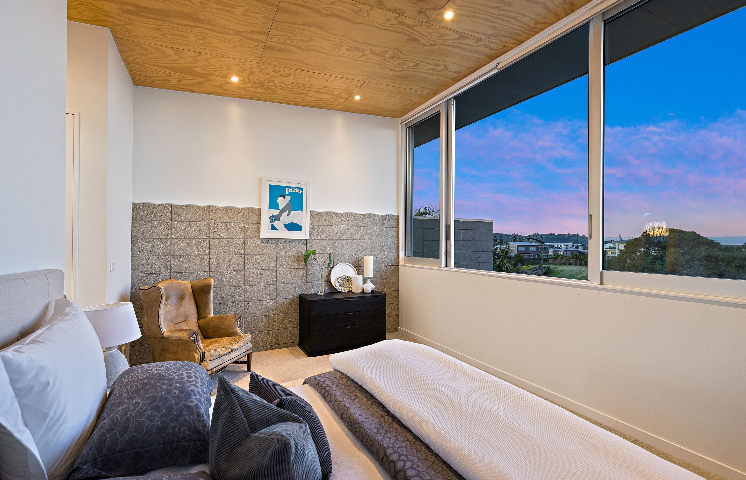 Master Bedroom and a clever private sitting space enjoy Living room features. Photo Credit:Amy Jenkins/Glasshouse Photography