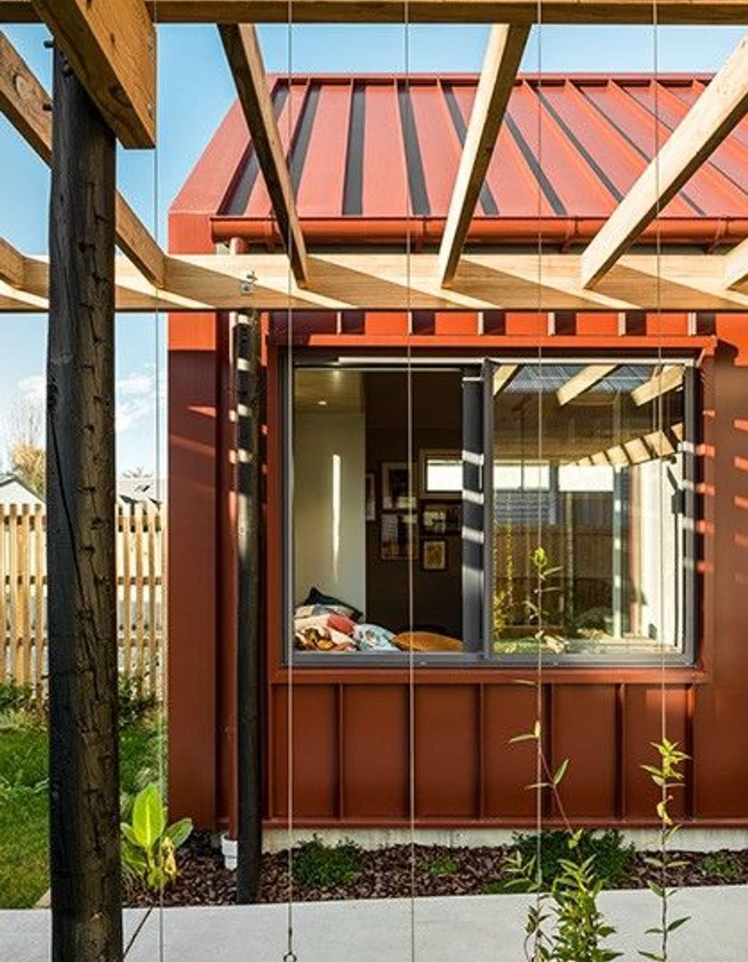 Referencing the original house, screens for scented climbing plants are used throughout the design. 