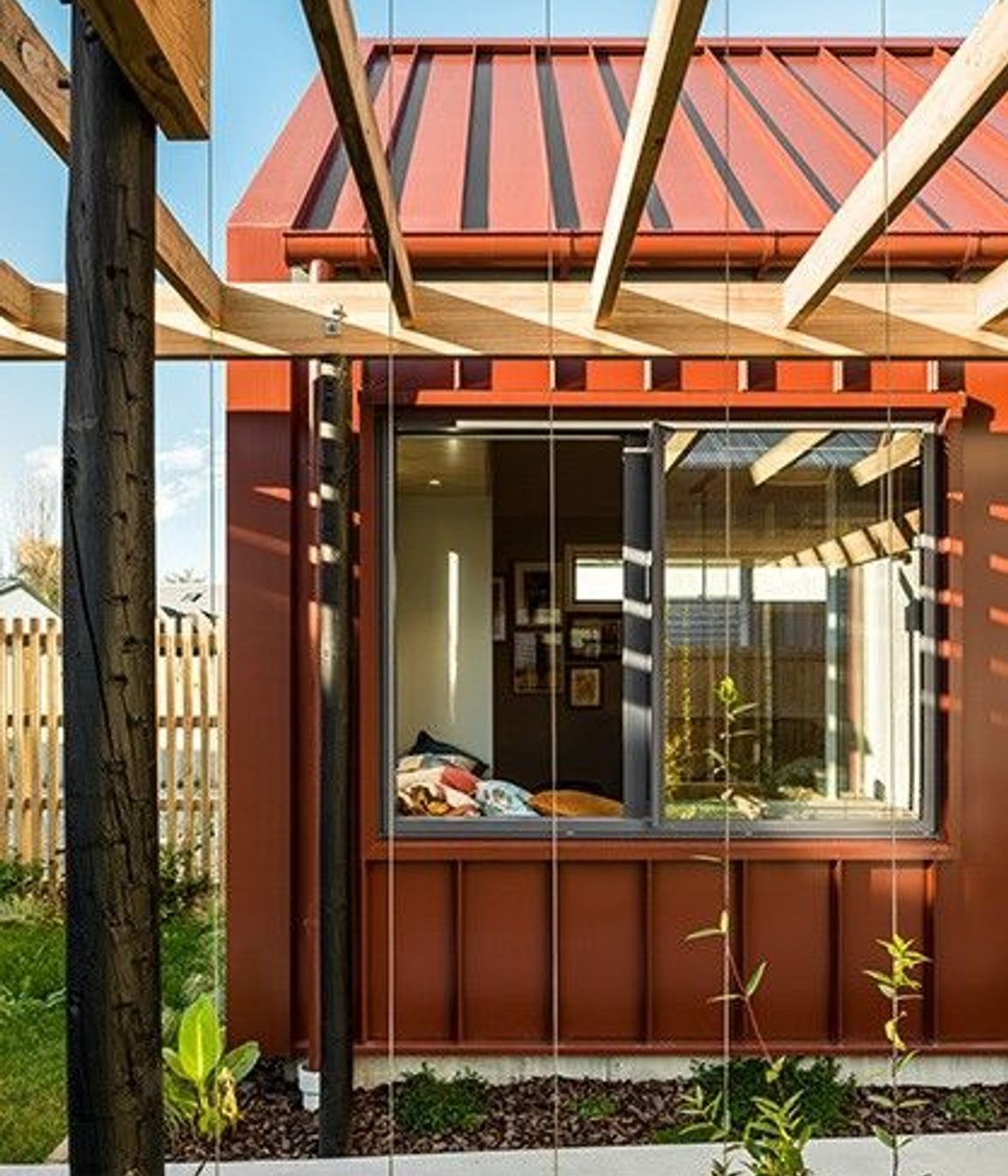 Referencing the original house, screens for scented climbing plants are used throughout the design. 