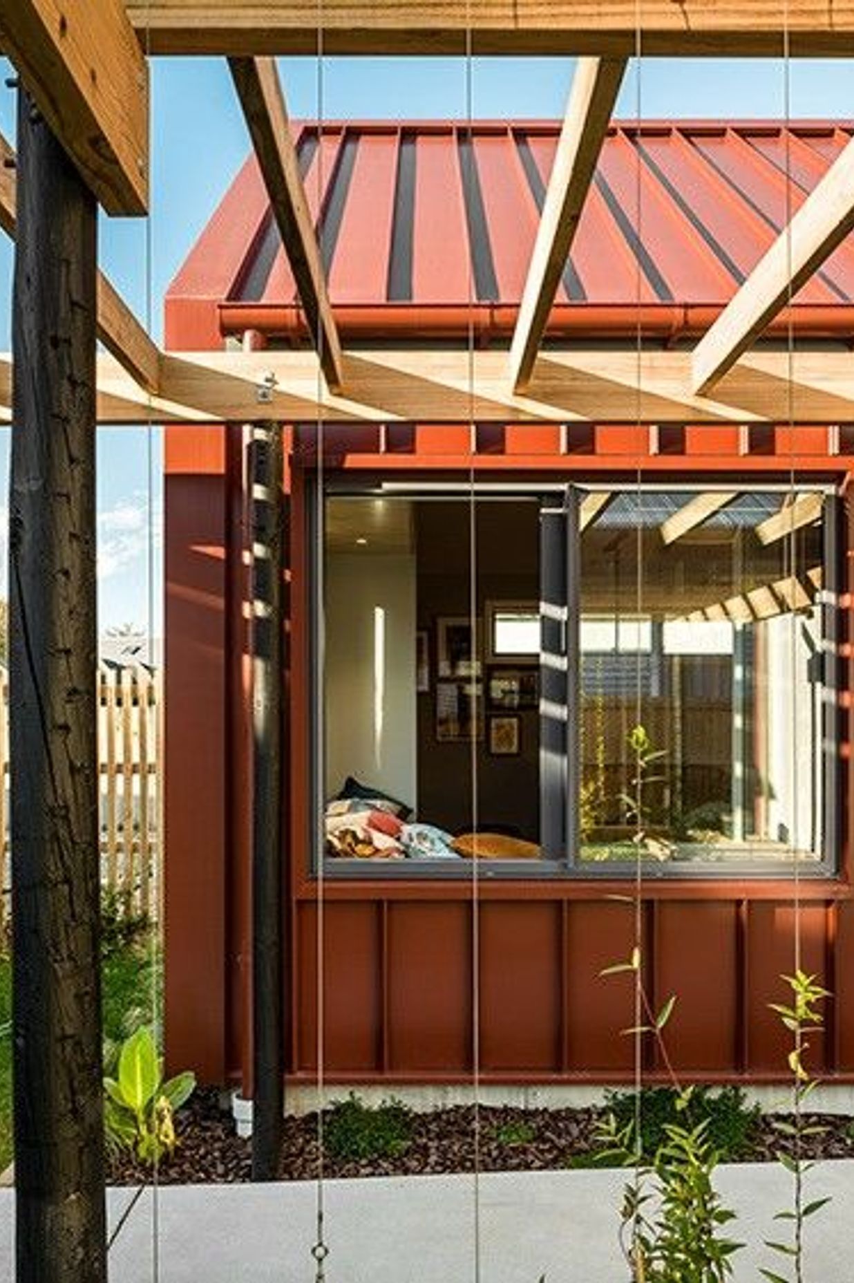 Referencing the original house, screens for scented climbing plants are used throughout the design.