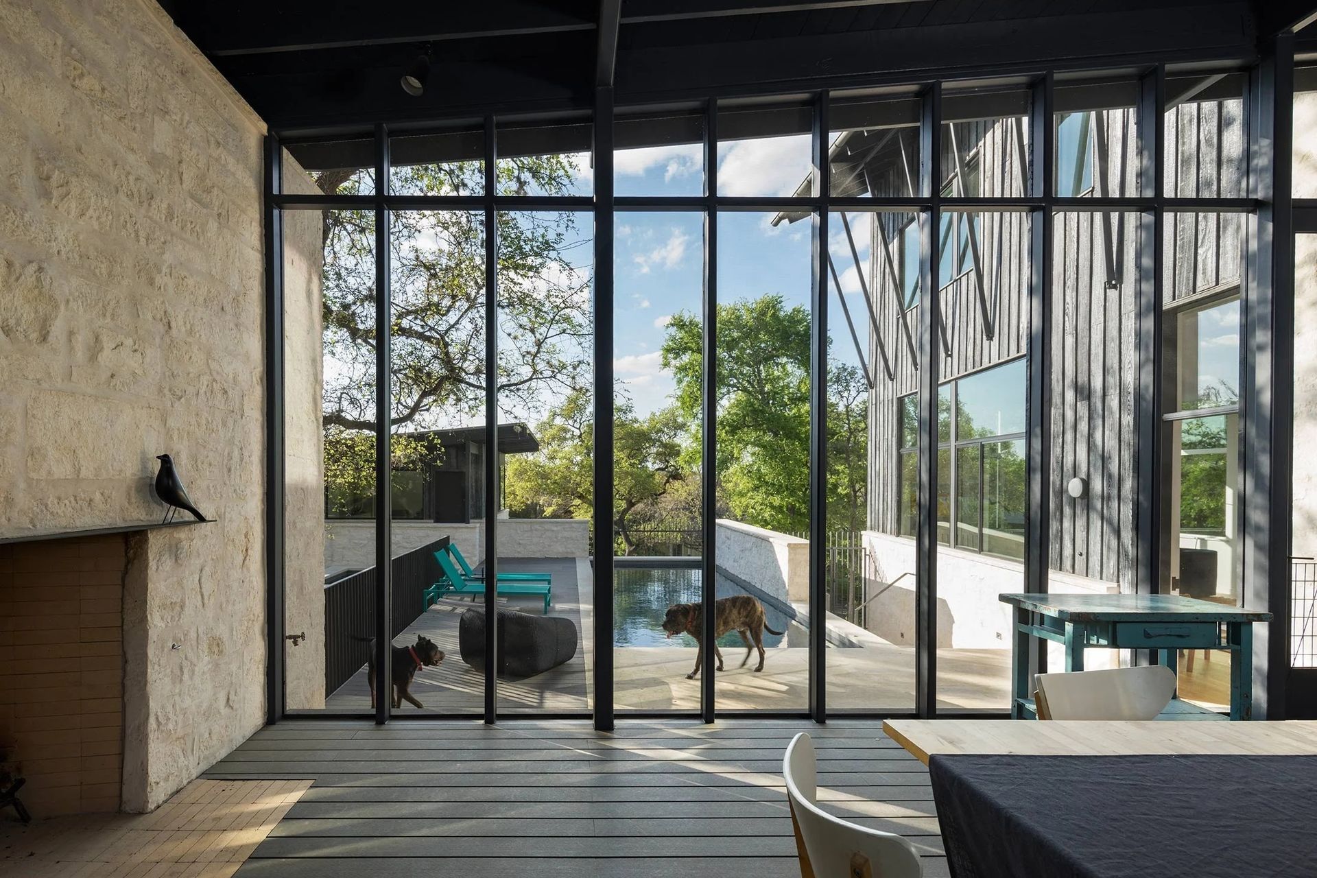 4HillsideCuppettKilpatrickArchitectureandInteriorDesignaustin-tx-screened-porch-dark-wood-frames-outdoor-fireplace-ap-compressed.jpg