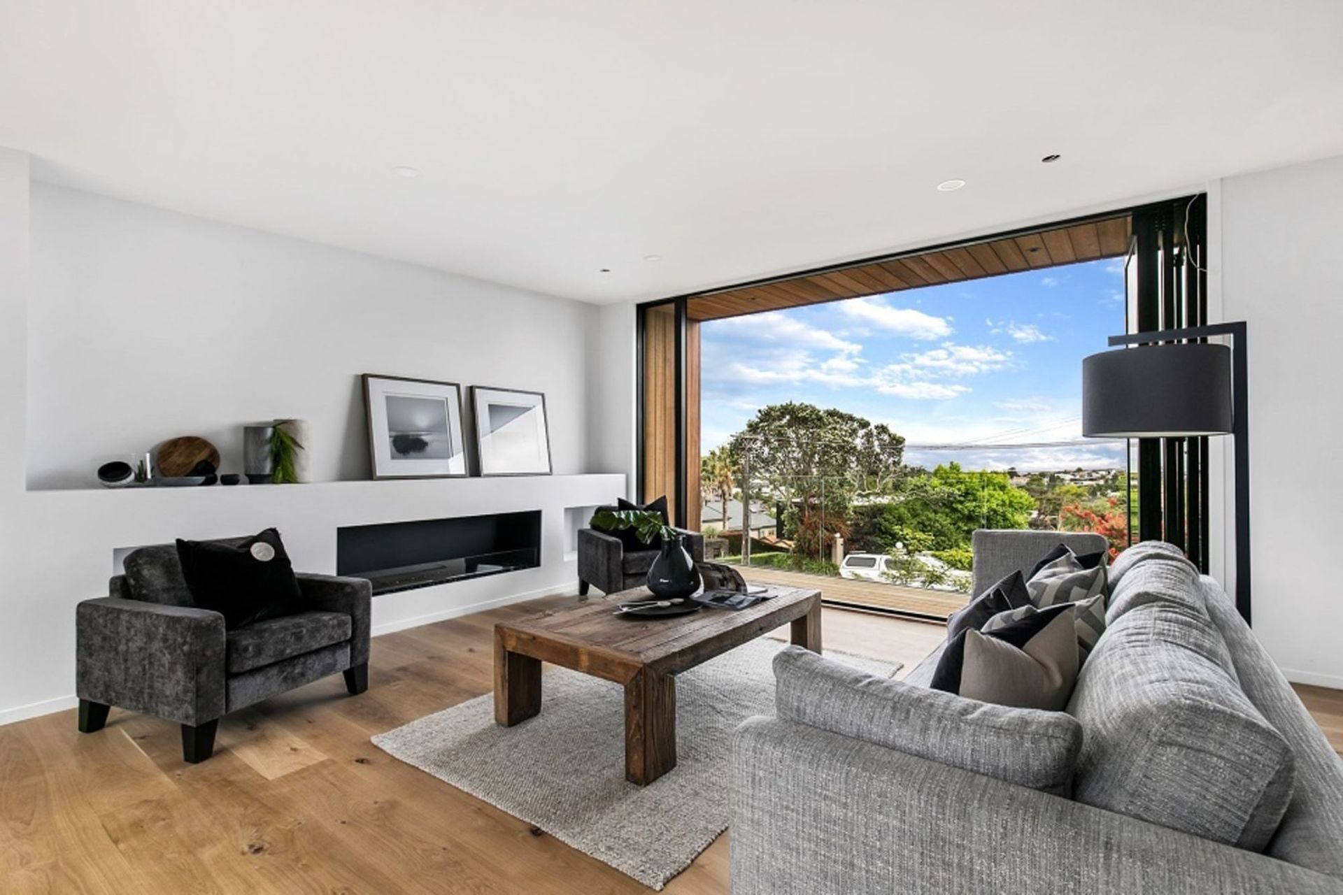 The north-facing balcony takes in the view over the neighbouring suburb and further afield towards Rangitoto.