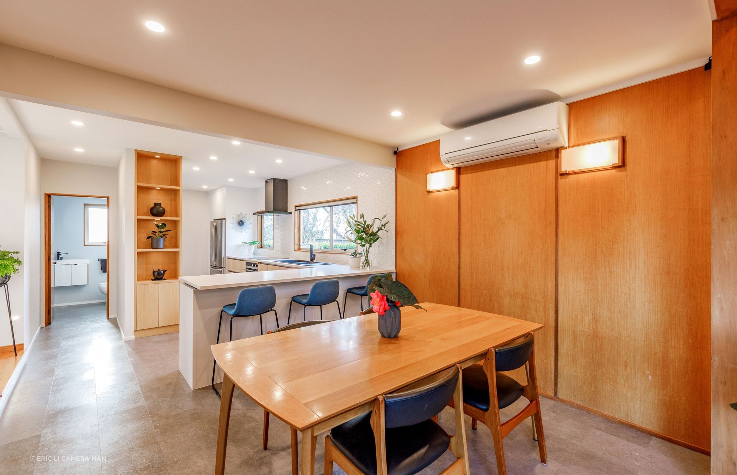 Knocking down walls between the hallway, kitchen, and dining area created a spacious and inviting atmosphere.