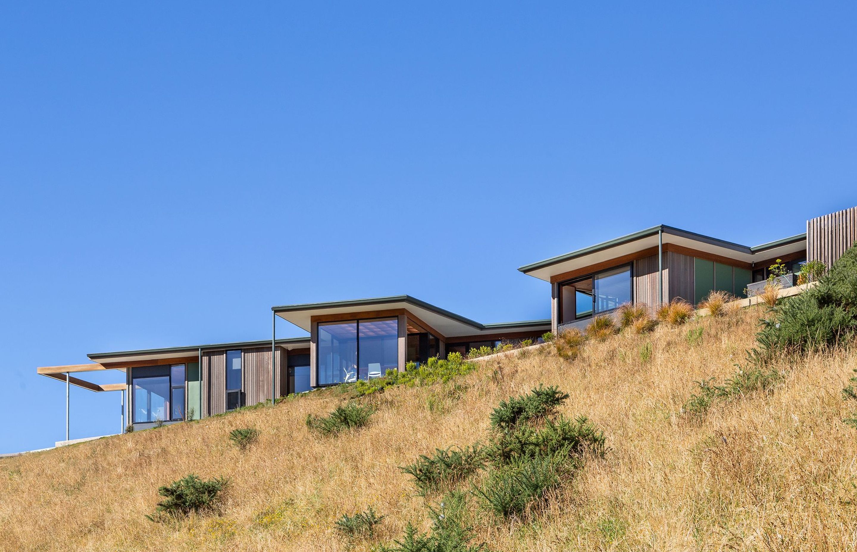 Large windows afford 'vignette-style' views from every room while wide eaves help mitigate solar gain from the afternoon sun.