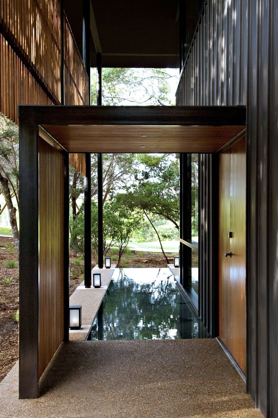 5HouseinTreesCuppettKilpatrickArchitectureandInteriorDesignaustin-tx-modern-entry-lap-pool-wood-panel.jpg